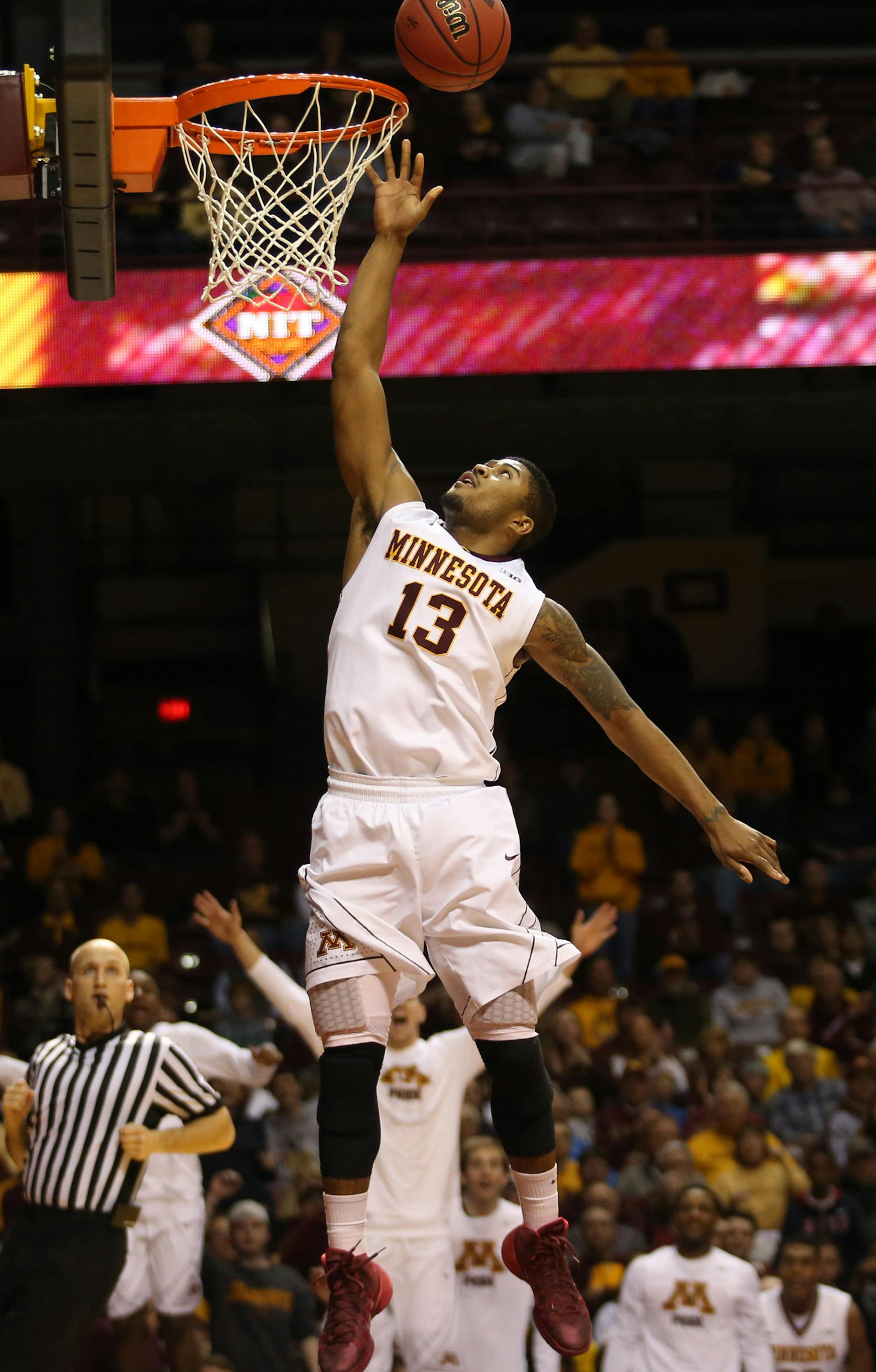 Gopher Maverick Ahanmisi went for the easy layup in the second half. ] (KYNDELL HARKNESS/STAR TRIBUNE) kyndell.harkness@startribune.com First round of the National Invitational Tournament at Williams Arena in Minneapolis Min, Tuesday March 18, 2014. Gophers won 88-81 over High Point.