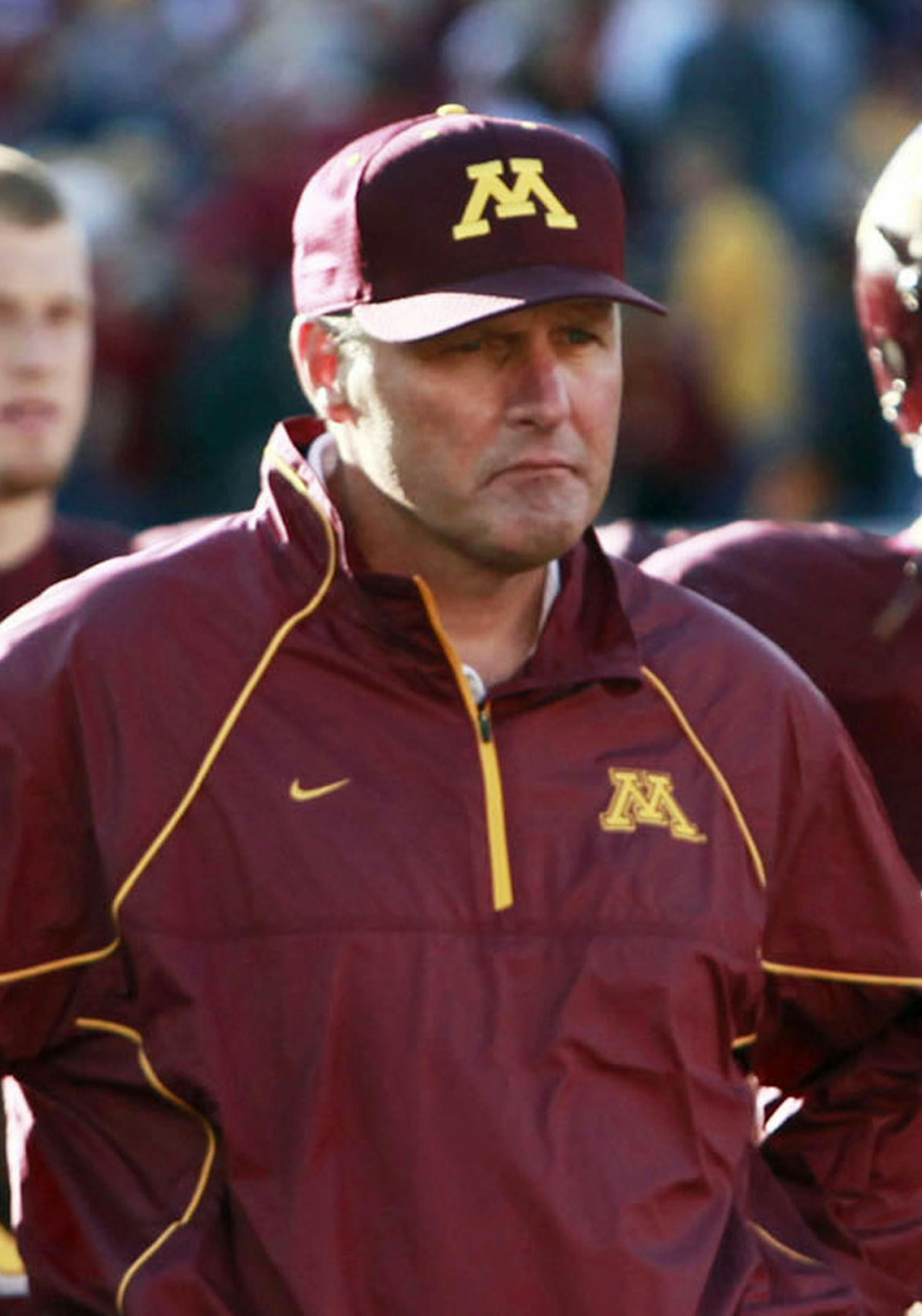 Minnesota coach Tim Brewster and his players listen to the band following a 32-21 loss to Southern California at TCF Stadium in Minneapolis, Minnesota, on Saturday, September 18, 2010. (David Joles/Minneapolis Star Tribune/MCT)