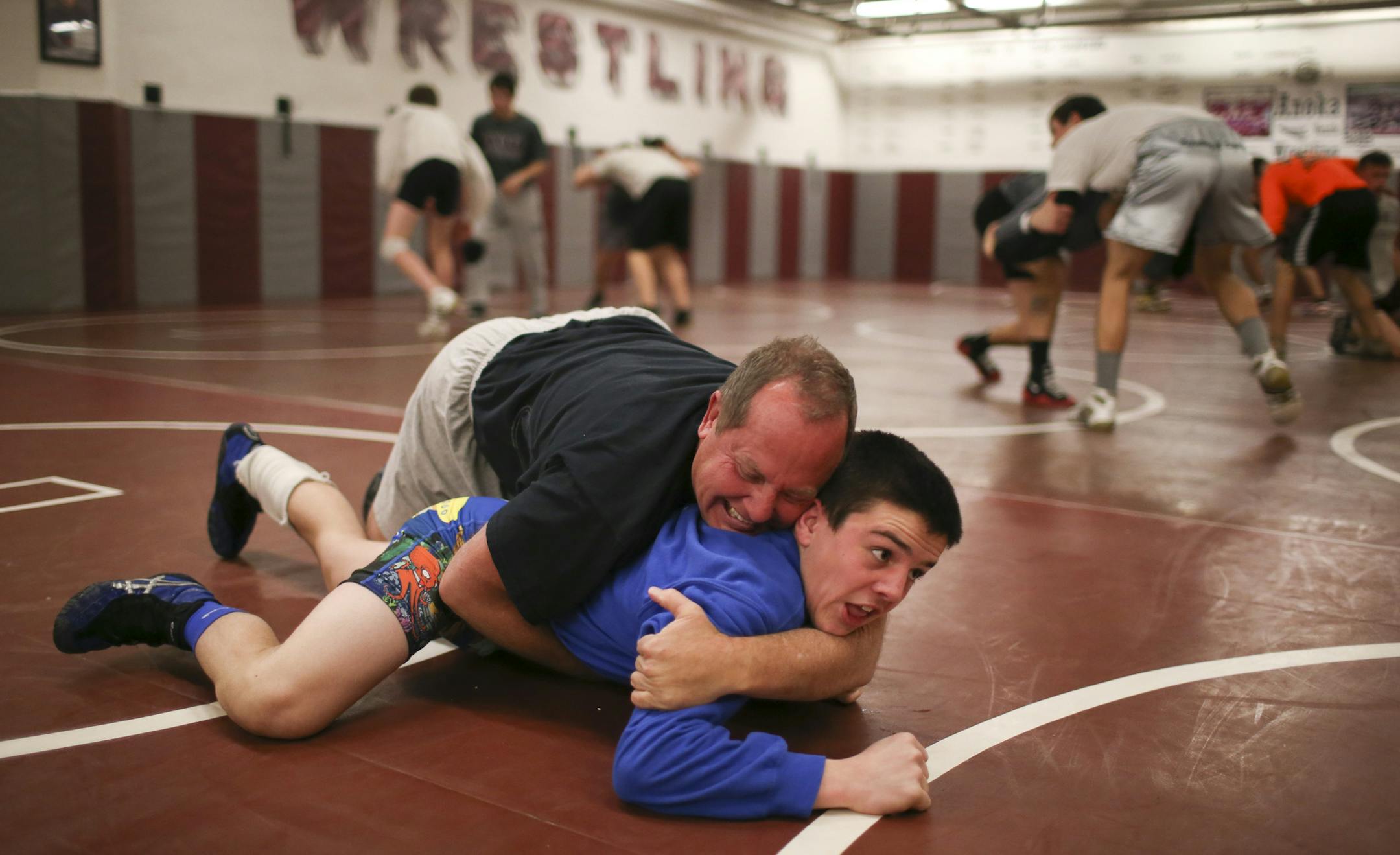 Calvin Germinaro is a 9th grade wrestler who has been tearing up the mats this summer and should be a top contender in the state at 113 this year. He is the nephew to Olympic Silver Medalist Brandon Paulson. But he has a special bond with one of his favorite volunteer coaches, Doug Paulson, his Grandpa and Brandon's father. Doug has volunteered with the Anoka wrestling program for more than 25 years. Calvin Germinaro warmed up by wrestling with his grandfather, Doug Paulson, who still has a few