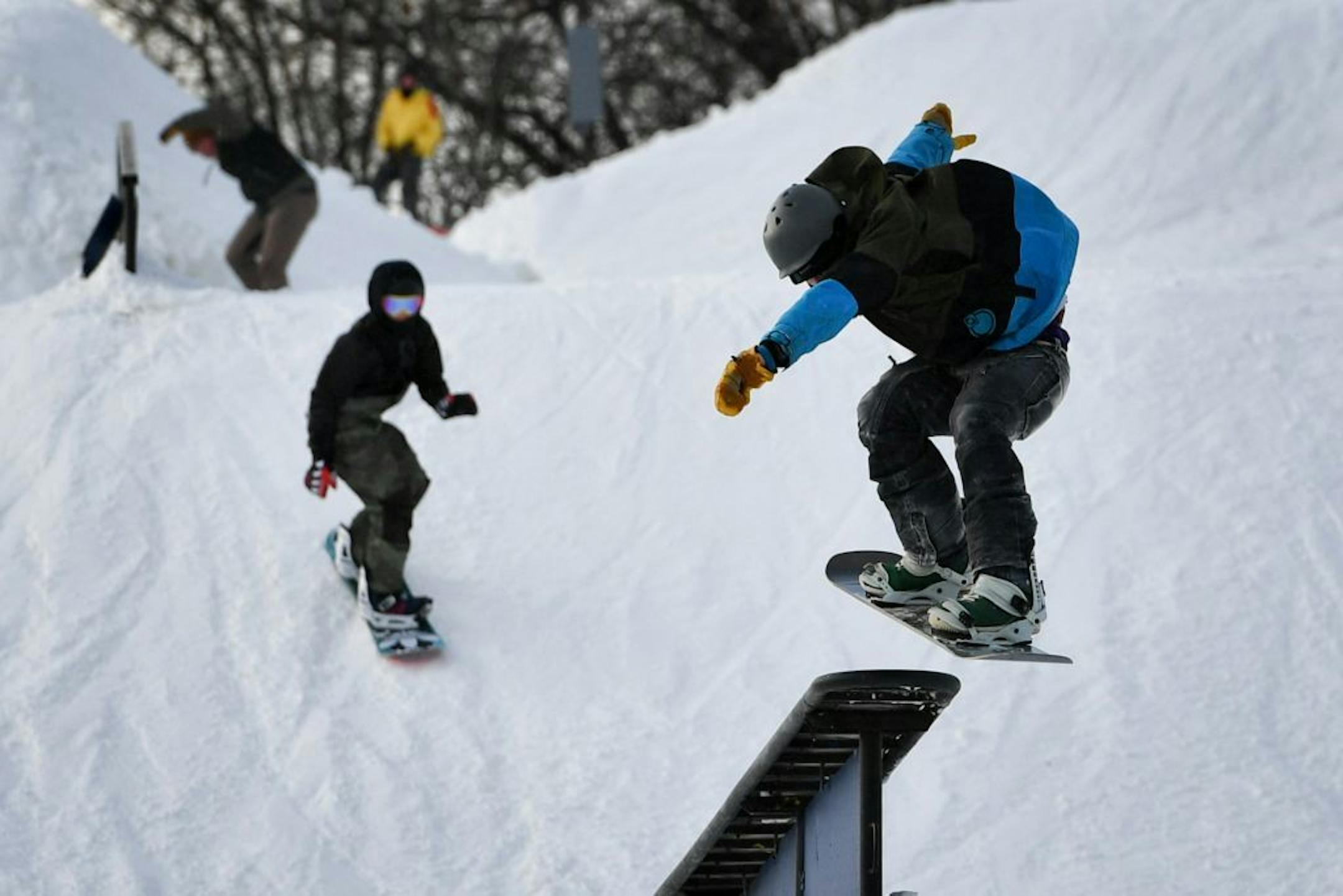 Skiiers and snow boarders at Hyland Hills ski area in Bloomington.