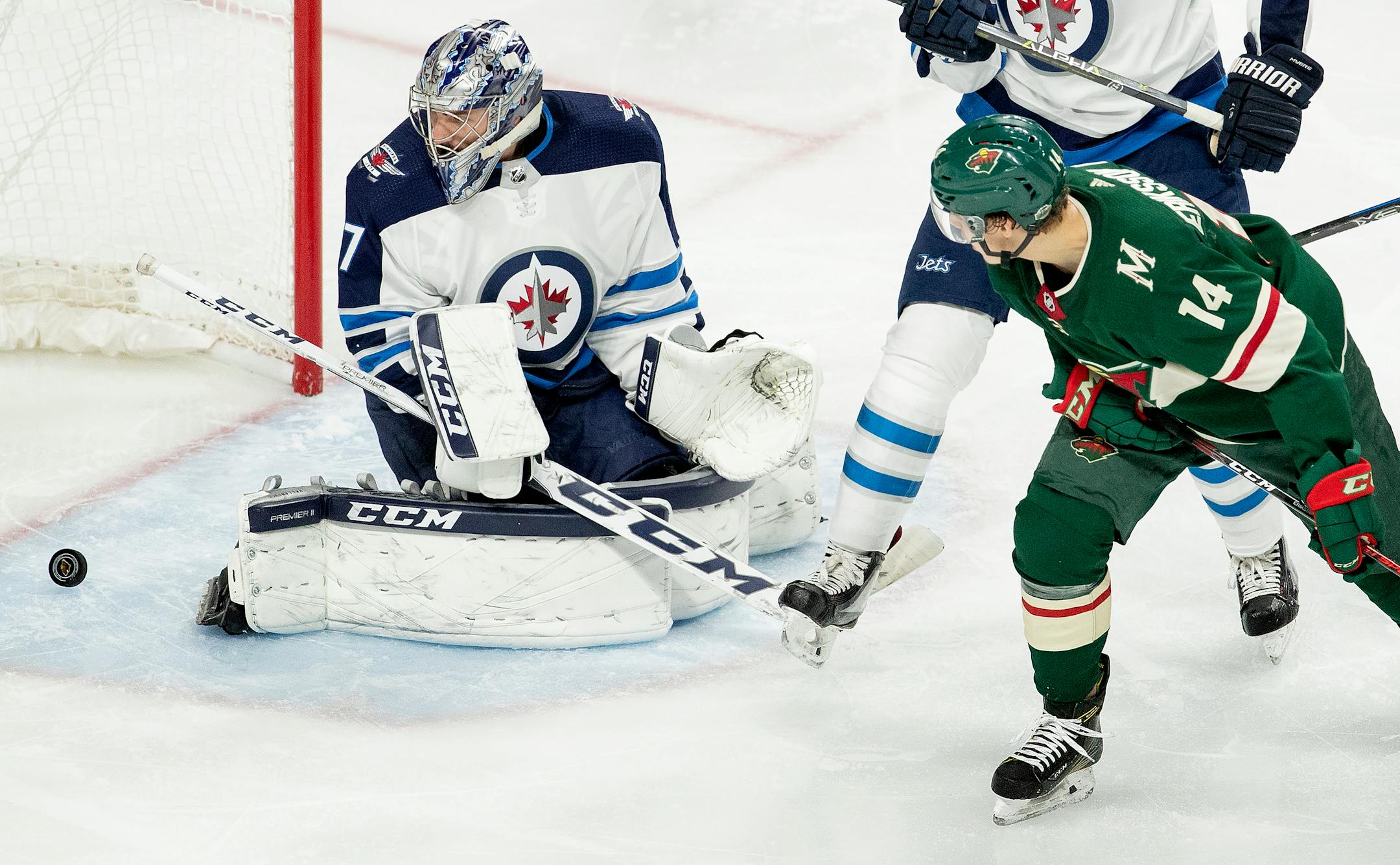 Matt Dumba (not in frame) got the puck past Connor Hellebuyck (37) for a goal in the second period on Sunday.