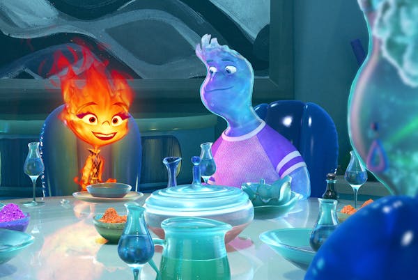 Ember, left, voiced by Leah Lewis, and Wade, voiced by Mamoudou Athie, have a fire-and-water love story in “Elemental.”