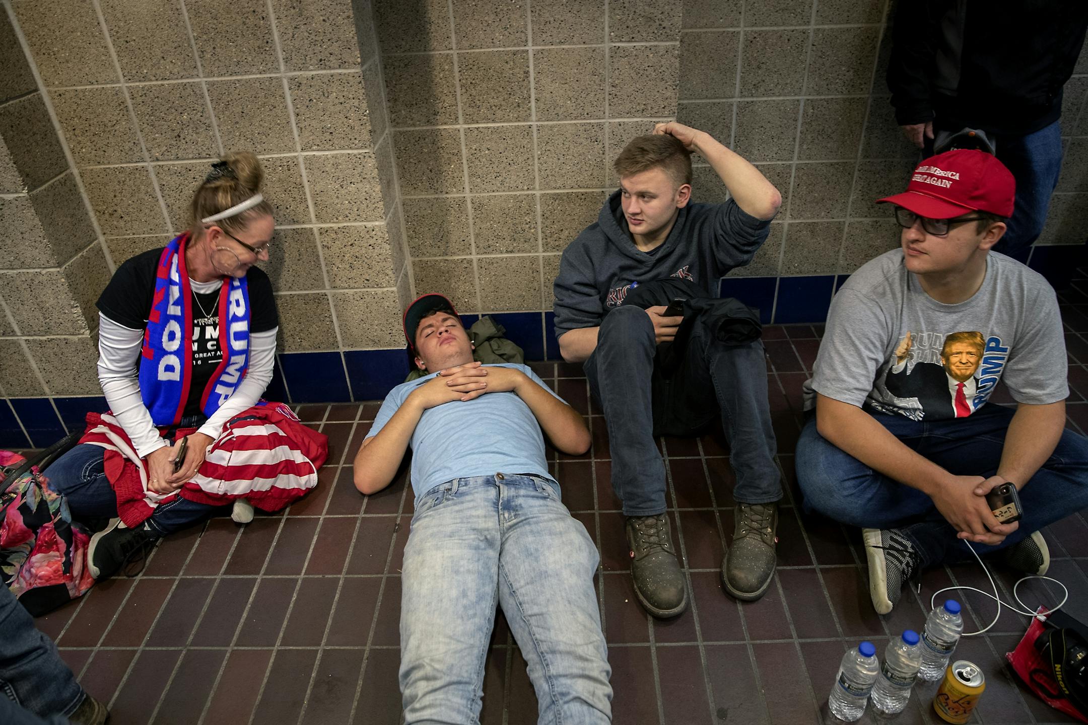 Trump supporters waited in line in the skyway leading to the Target Center in preparation for President Trump's visit.