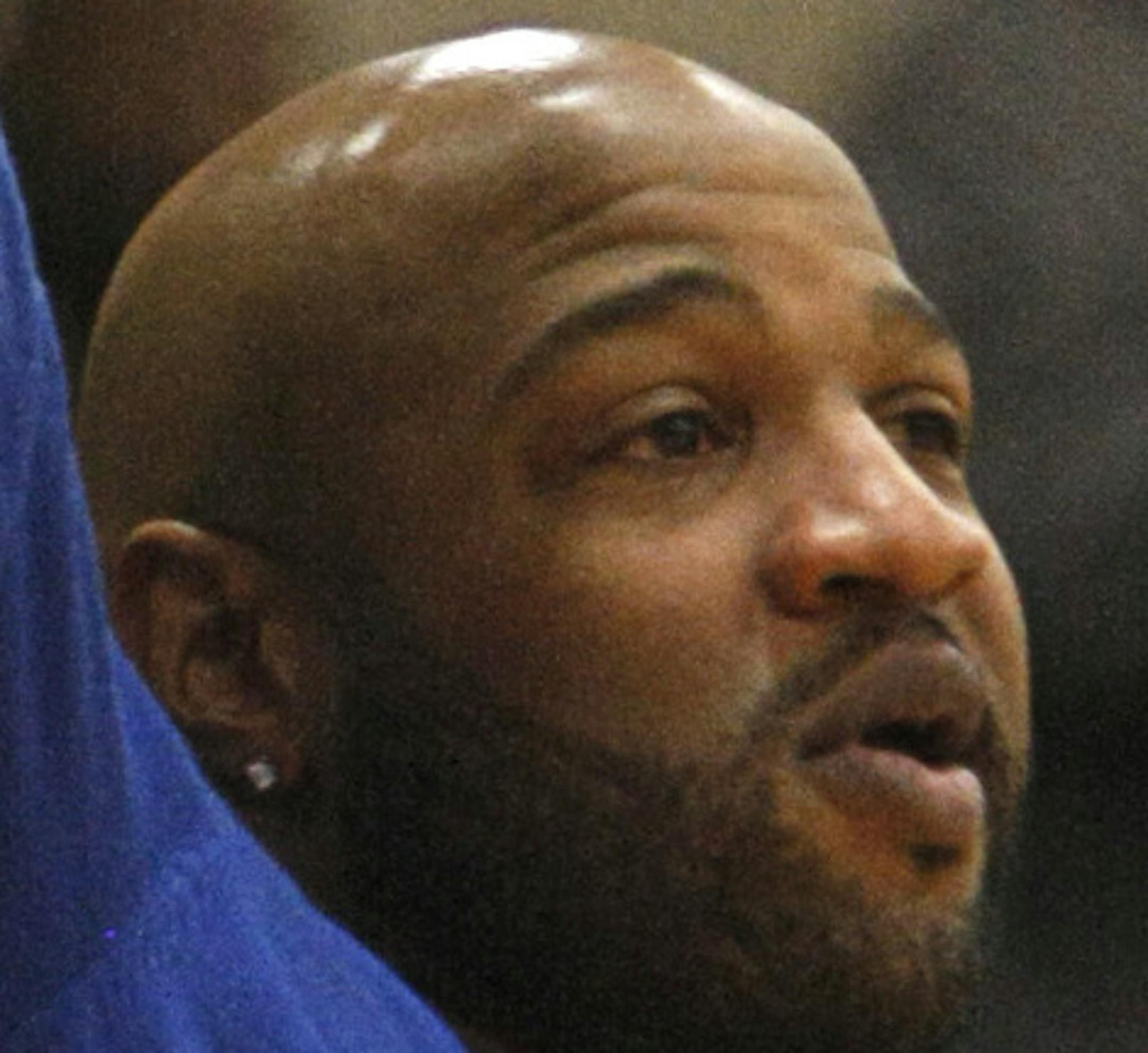 Minneapolis North alaumn Khalid El-Amin cheers on the Polars during the second half of their 83-70 victory at Minneapolis Henry on Friday, January 10. ] Chris Kelleher, Special to the Star Tribune, 1/10/2014, Minneapolis, Minn. EXTRA INFO: 20032636A_PREP011114