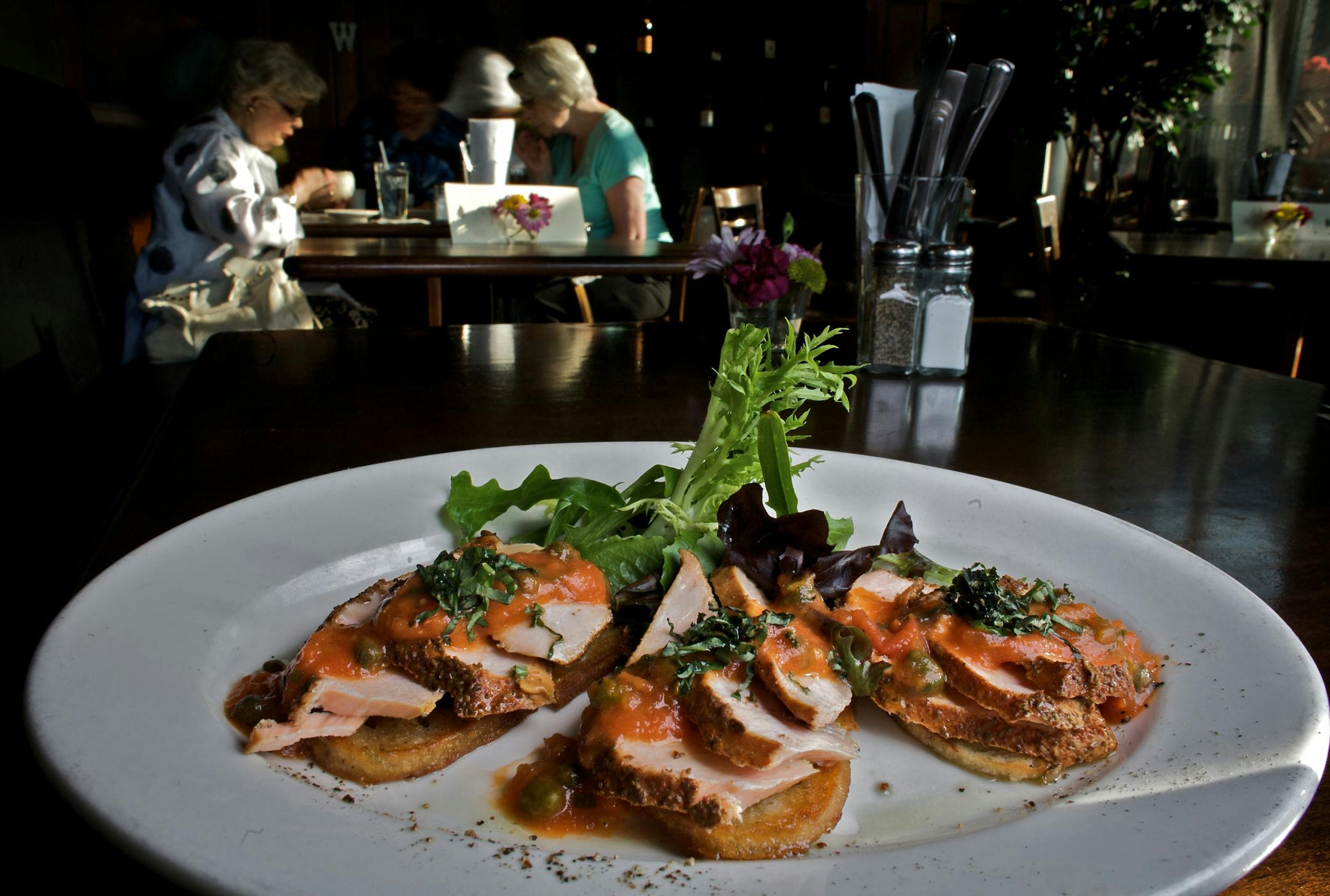 It's called Sauced for a reason: Crostini topped with house-smoked salmon and a roasted tomato sauce, one of the appetizers.