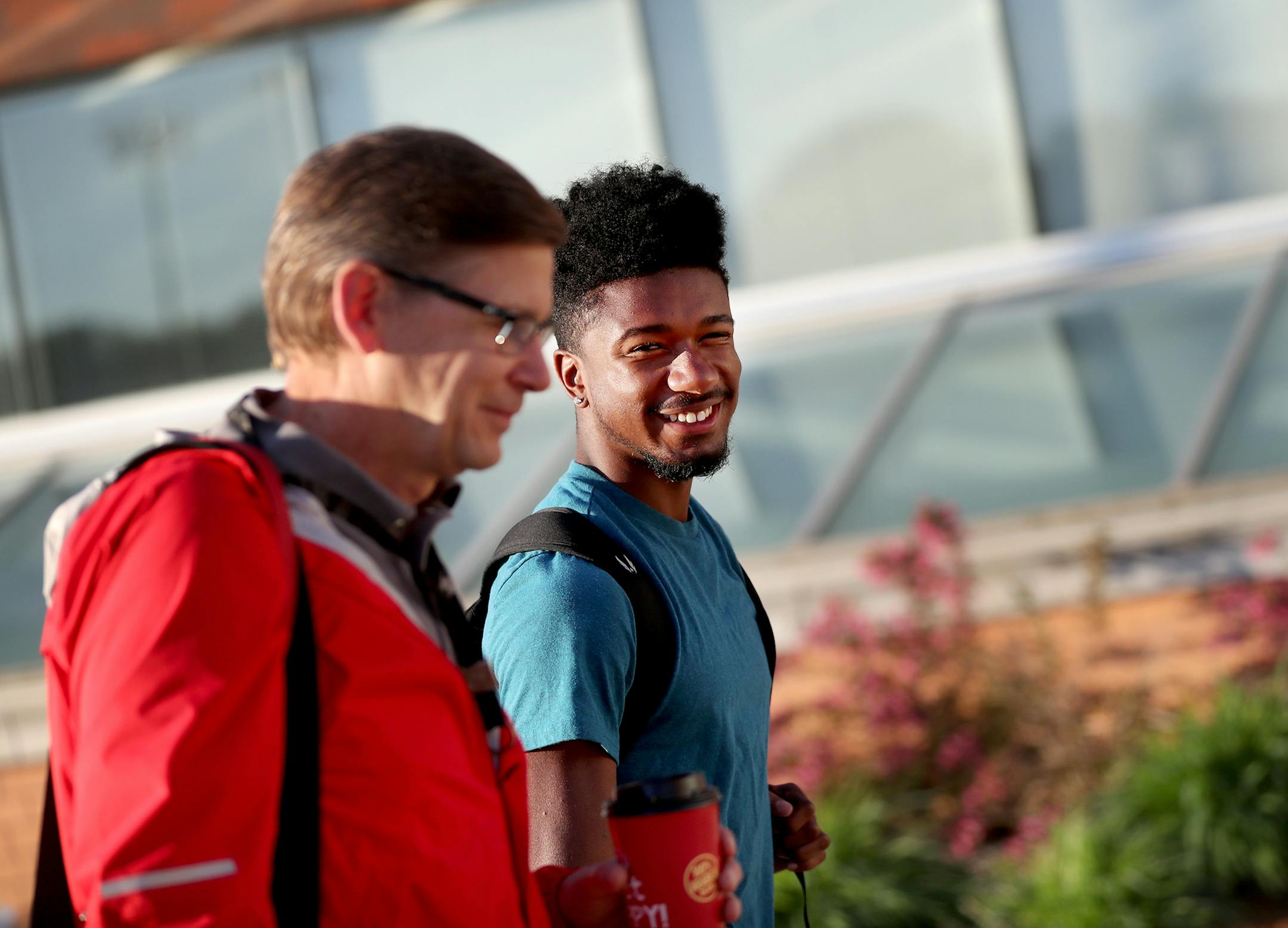 Eden Prairie sprinter Denzel Brown, right, the state's top male track and field athlete, got a ride to school from Bruce Kivimaki, his track and field coach and a pivotal mentor, at 6:30 a.m. Brown then worked to catch up on his geometry homework.