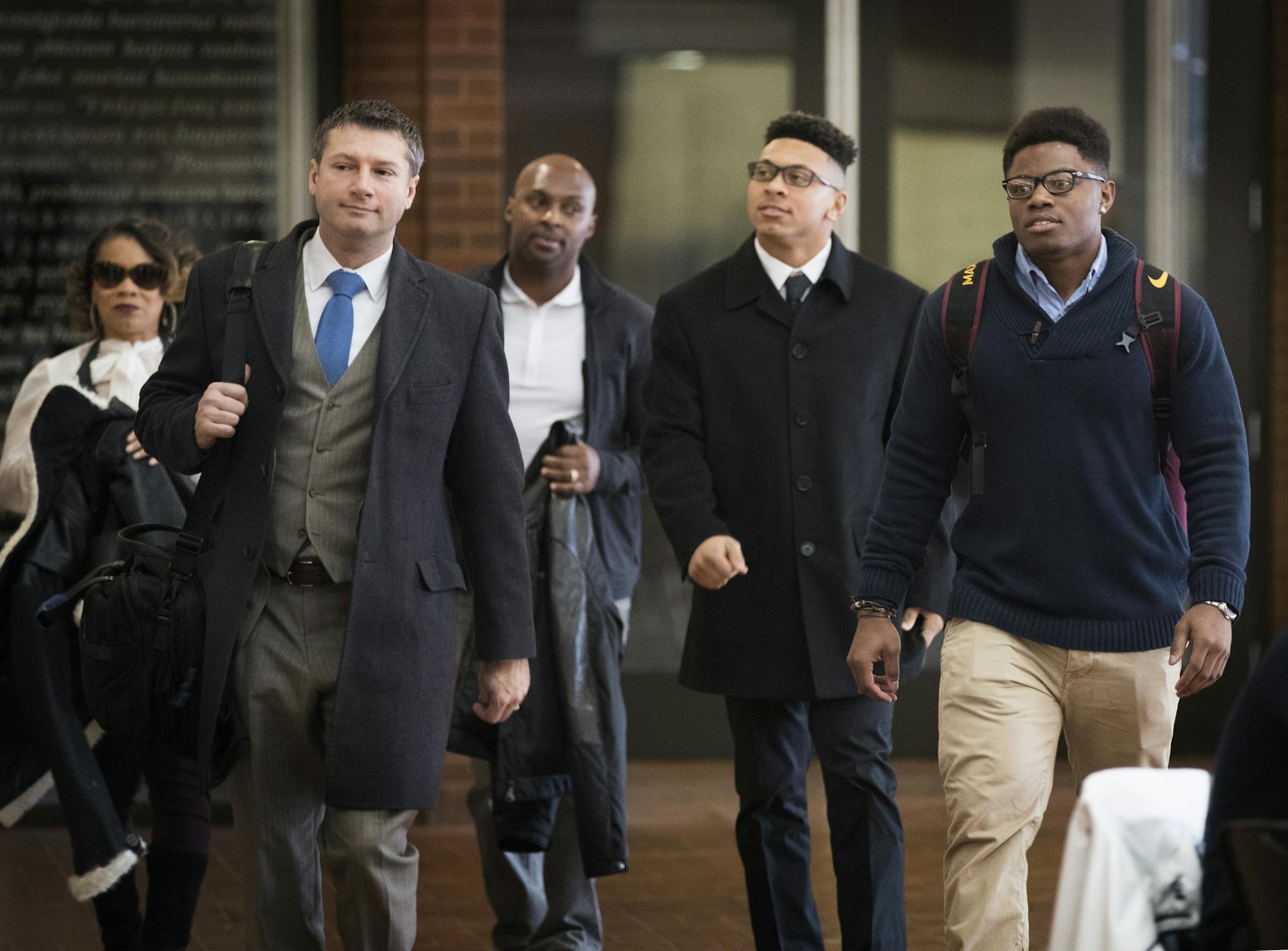 Lawyer Ryan Pacyga, left, walks with Minnesota football players Carlton Djam, from right, and Antoine Winfield, Jr, accompanied by his father, former Vikings player Antoine Winfield, Sr. into their appeal hearing. ] (Leila Navidi/Star Tribune) leila.navidi@startribune.com BACKGROUND INFORMATION: Ten suspended University of Minnesota football players arrive at the Humphrey School of Public Affairs on the campus of University of Minnesota in Minneapolis on Thursday, January 26, 2017 for the appeal