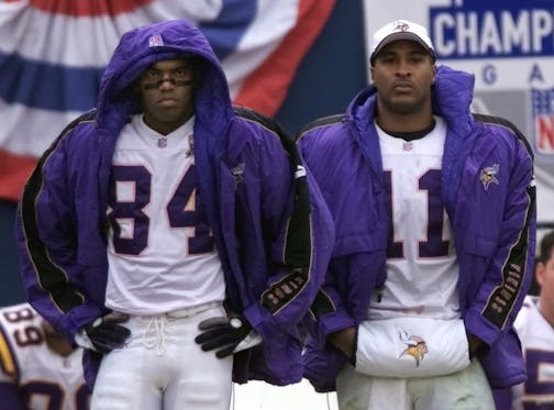Two none-too-pleased Vikings -- wide receiver Randy Moss (84) and quarterback Daunte Culpepper -- watched from the sidelines during the third quarter of a 41-0 rout by the Giants in the NFC Championship Game on Jan. 14, 2001, in East Rutherford, N.J.
