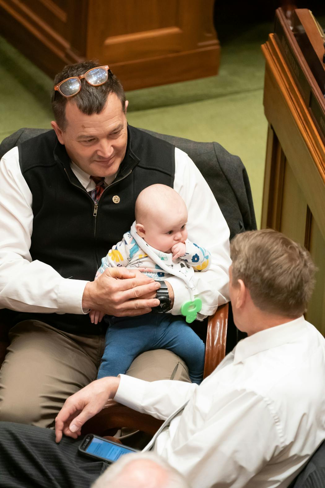 Rep. Leon Lillie, D-North St. Paul, took a turn holding Rep. Erin Koegel’s baby Clara, then five months old, in April 2019.