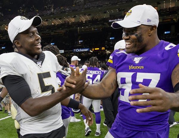 Saints quarterback Teddy Bridgewater and Minnesota Vikings Everson Griffen greeted each other after the game. ] CARLOS GONZALEZ &#x2022; cgonzalez@sta
