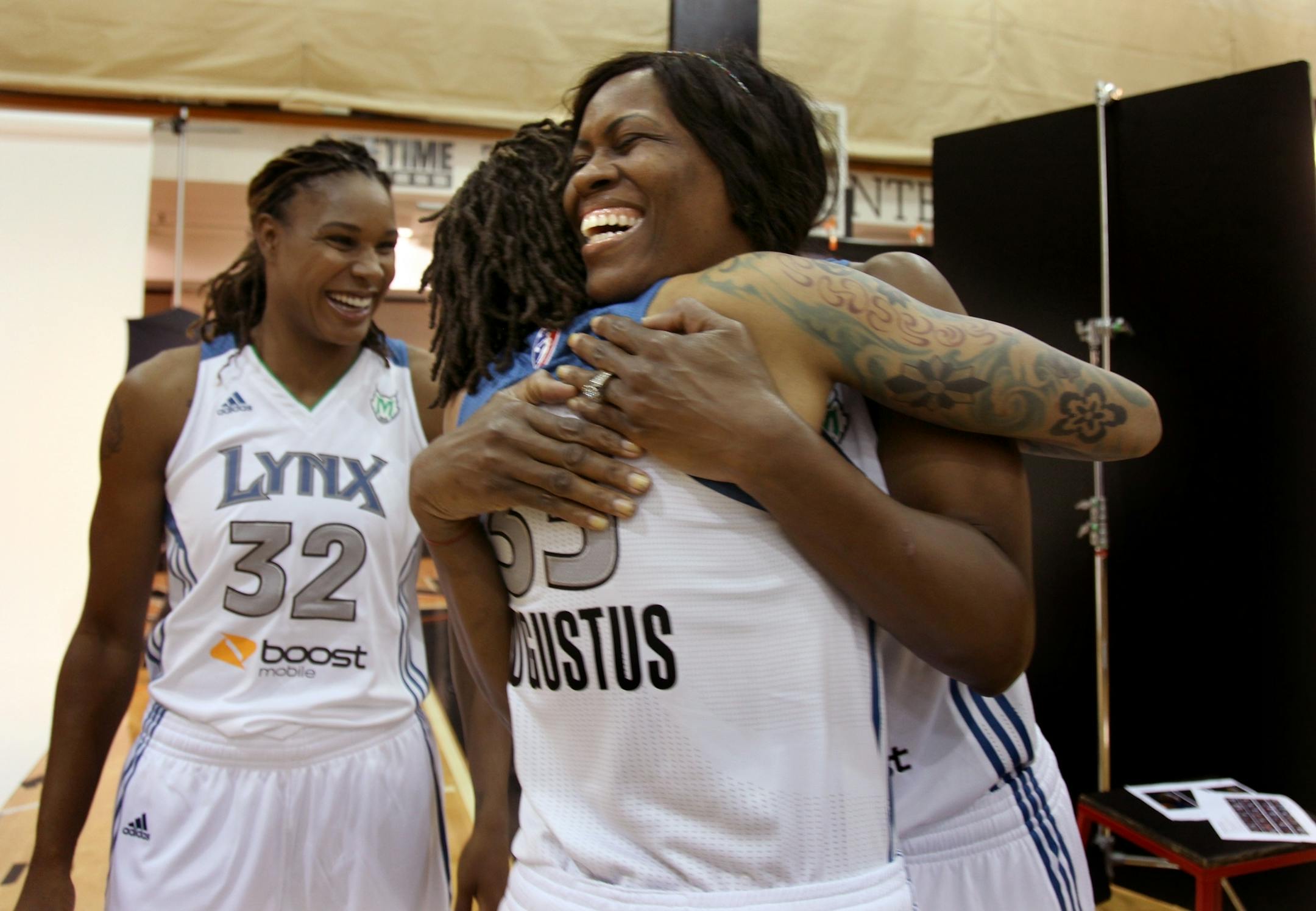Minnesota Lynx Taj McWilliams-Franklin was greeted with a hug by teammate Seimone Augustus and Rebekkah Brunson during media day for the championship team at their training facility, Monday, May 7, 2012 in Minneapolis, MN. (ELIZABETH FLORES/STAR TRIBUNE) ELIZABETH FLORES � eflores@startribune.com