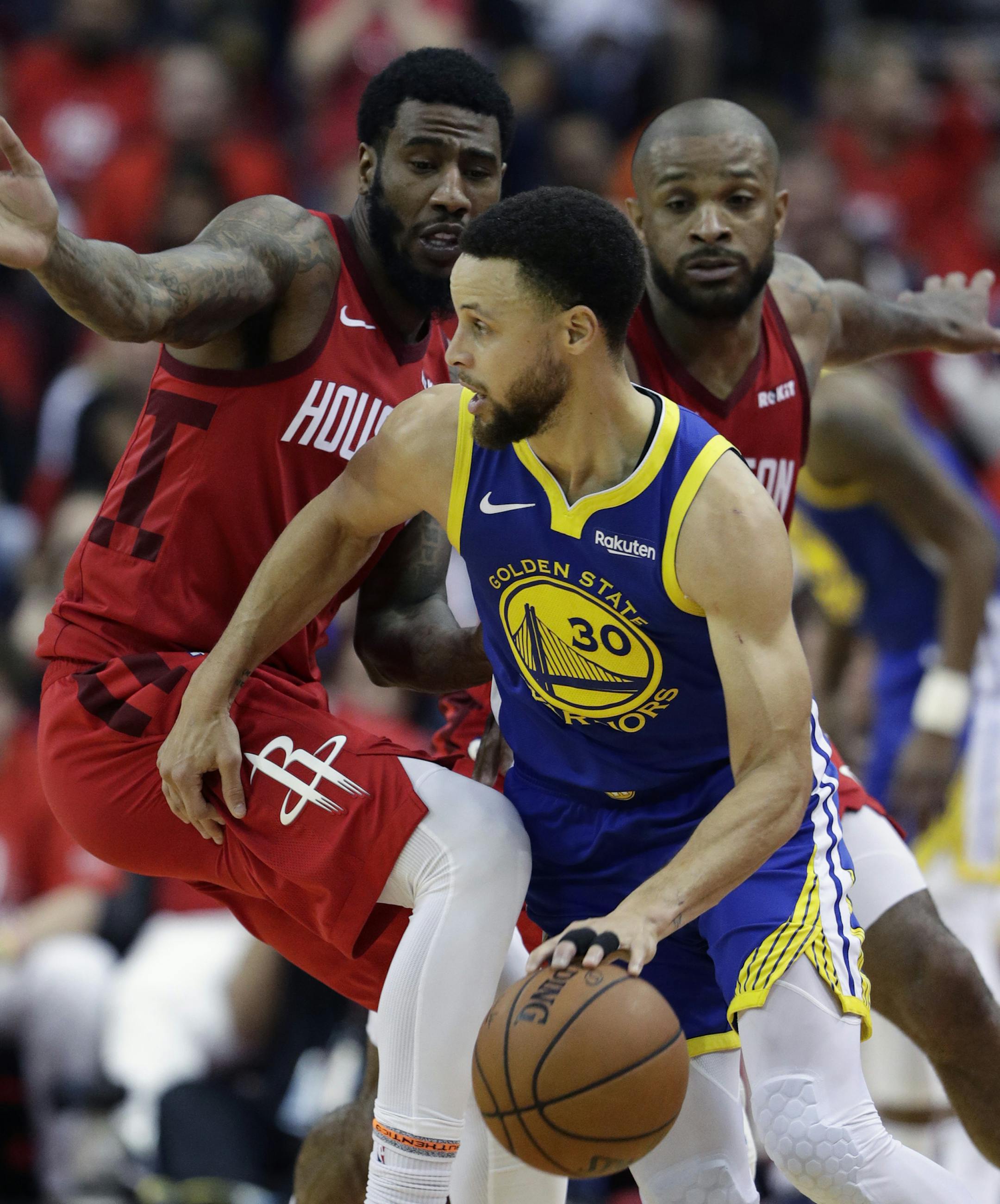 Golden State Warriors guard Stephen Curry (30) drives around Houston Rockets guard Iman Shumpert, left, and forward PJ Tucker during the second half in Game 6 of a second-round NBA basketball playoff series, Friday, May 10, 2019, in Houston. Golden State won 118-113, winning the series. (AP Photo/Eric Gay)