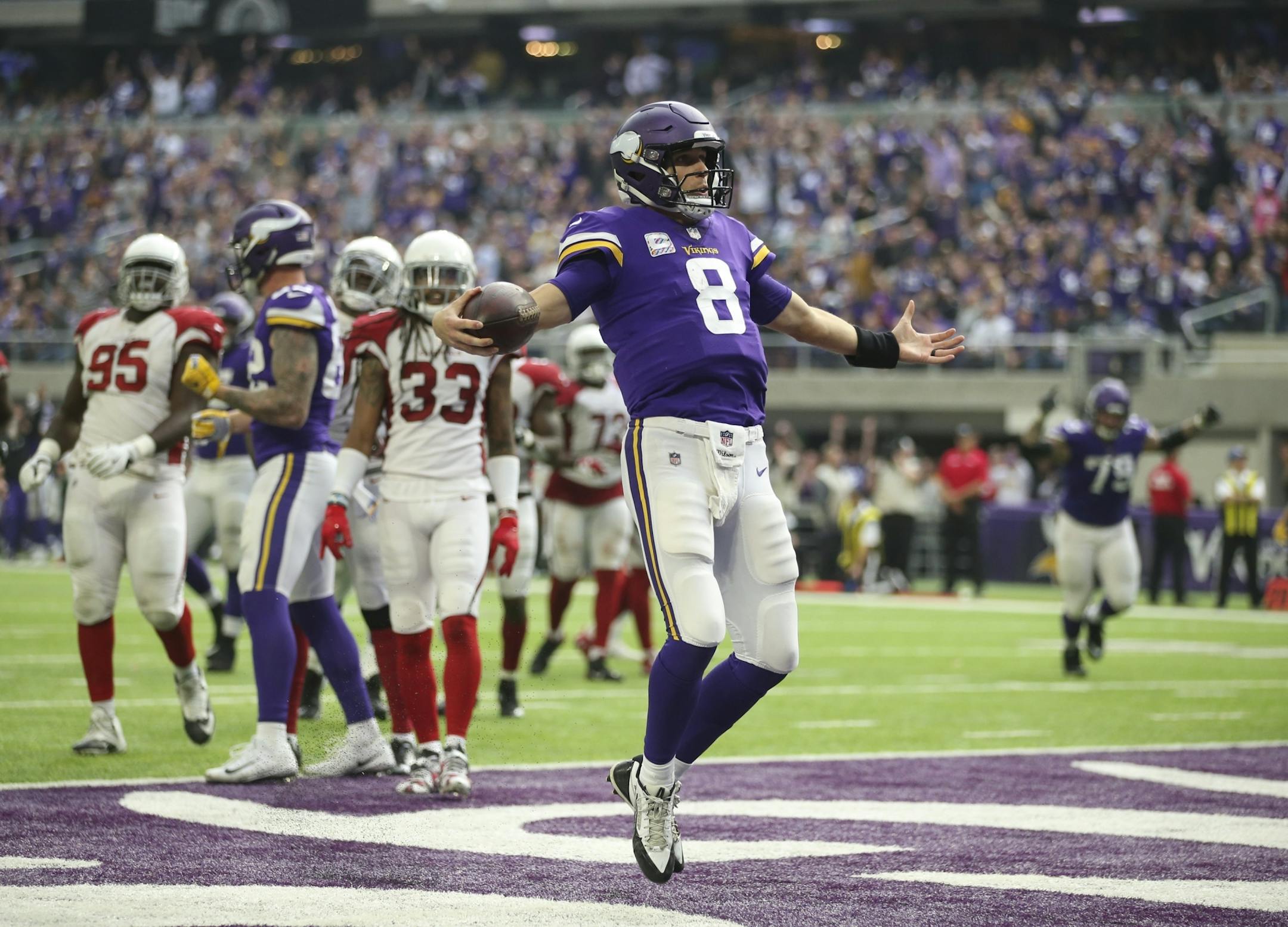 Minnesota Vikings quarterback Kirk Cousins celebrated after he pranced into the end zone untouched on a seven yard touchdown run in the third quarter.