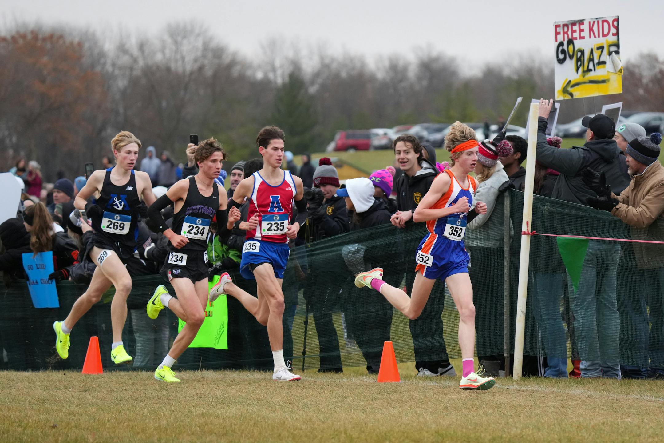 Aiden Jones leads in the middle of the 3A boys cross country race, followed closely behind by (from left) Nick Gilles, Sam Scott, and Noah Breker.