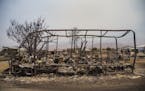 A frame is all that remains of an RV destroyed by the Erskine Fire in South Lake, Calif., on Sunday, June 26, 2016.
