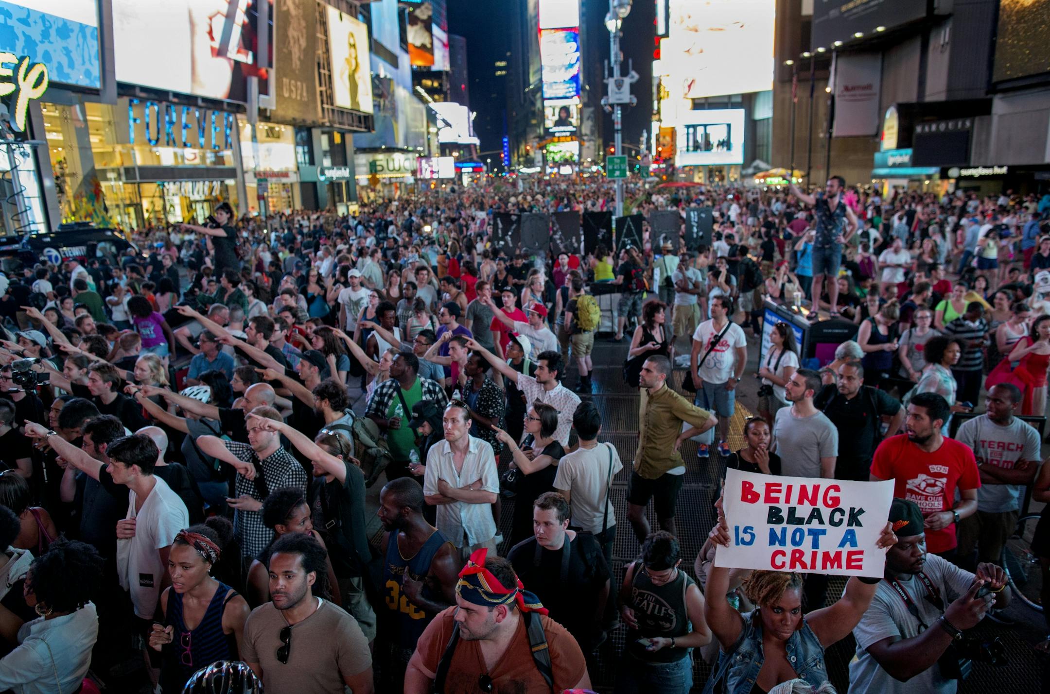 Throngs of marches gather in Times Square, Sunday, in New York, for a protest against the acquittal of volunteer neighborhood watch member George Zimmerman in the 2012 killing of 17-year-old Trayvon Martin.
