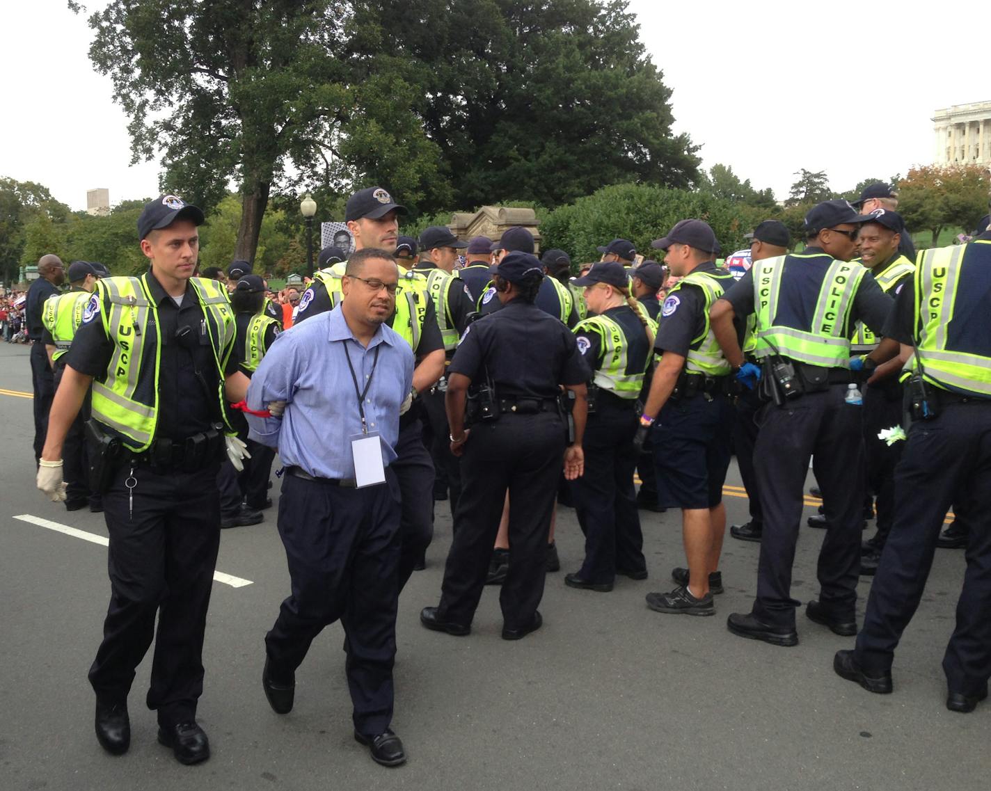 Police led U.S. Rep. Keith Ellison away in cuffs shortly after 4 p.m. Tuesday in Washington, D.C.