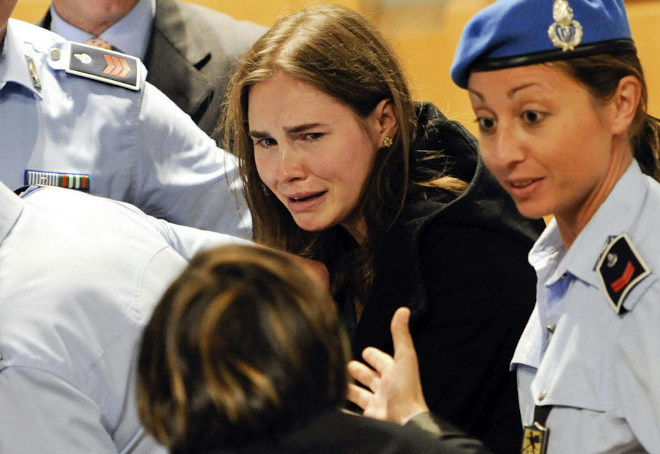 Amanda Knox cries following the verdict that overturned her conviction and acquitted her of murdering her British roomate Meredith Kercher.