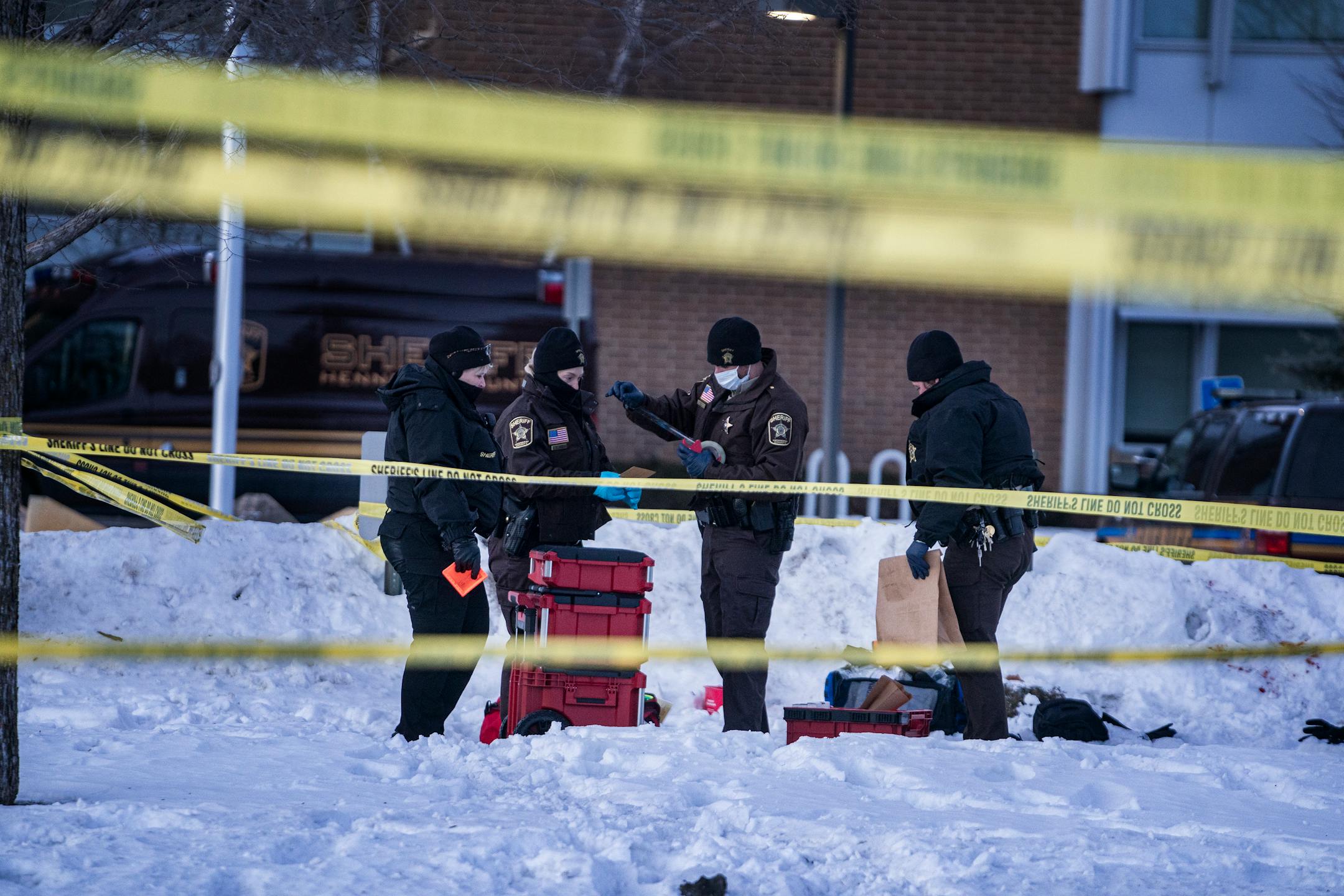 Police collect evidence from the shooting death of Jahmari Rice who was killed in a shooting outside South Education Center , in Richfield, Minn., on Tuesday, Feb. 1, 2022. A vigil followed. ] RICHARD TSONG-TAATARII • richard.tsong-taatarii@startribune.com