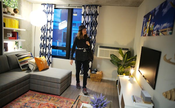 Janet Lewis explores a micro unit on the third floor that rents for $1250 a month and is 540 square feet.] The developer of the new City Club Apartmen