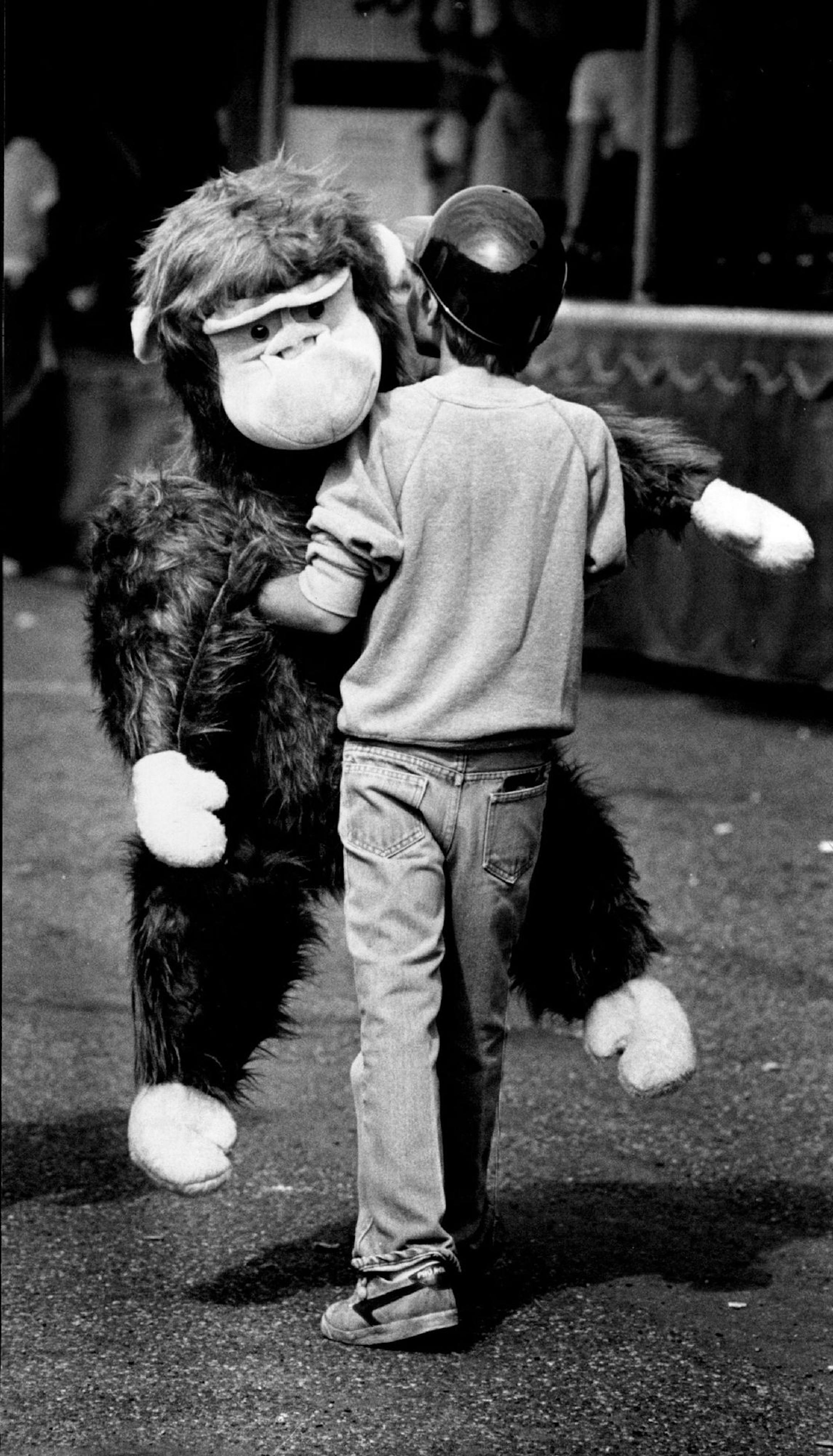 August 27, 1982 A winner and a sleeper They come for the treats and the rides, and the games, and the prizes, and the exhibits, and, and ... whew! The state fair holds a certain mystique for children. Isaac Larsen, 9, of St. Paul, had a little zip In his step as he walked along the midway with a stuffed gorilla that he won at the ring toss game (No hangers!!). Neil McGahee, Minneapolis Star Tribune