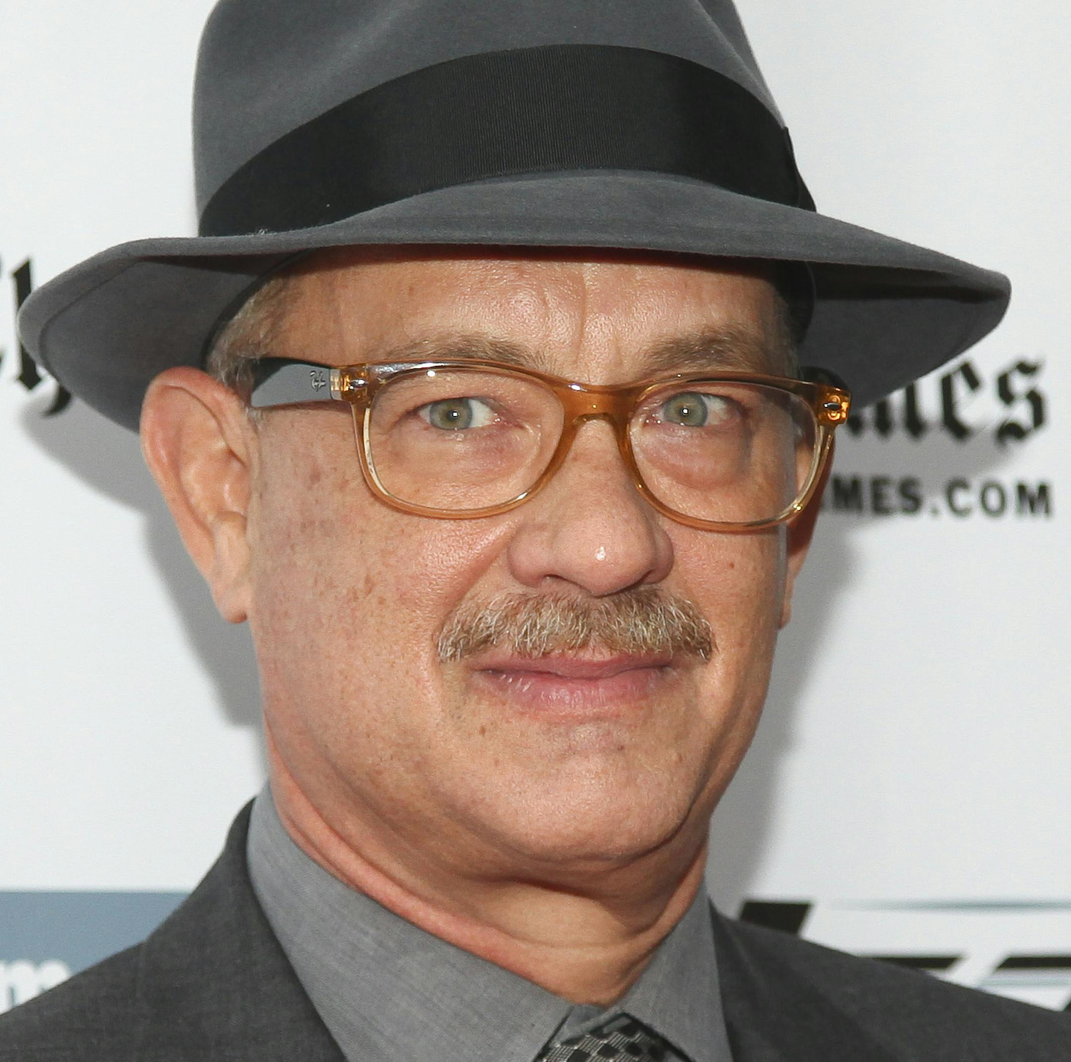 FILE - In this Oct. 4, 2015, file photo, Tom Hanks attends the New York Film Festival "Bridge of Spies" premiere at Alice Tully Hall in New York. WNBC-TV reports Hanks found a student identification card Tuesday, Oct. 6, 2015, belonging to a Fordham University student and tweeted a photo of it to find its owner. (Photo by Andy Kropa/Invision/AP, File)