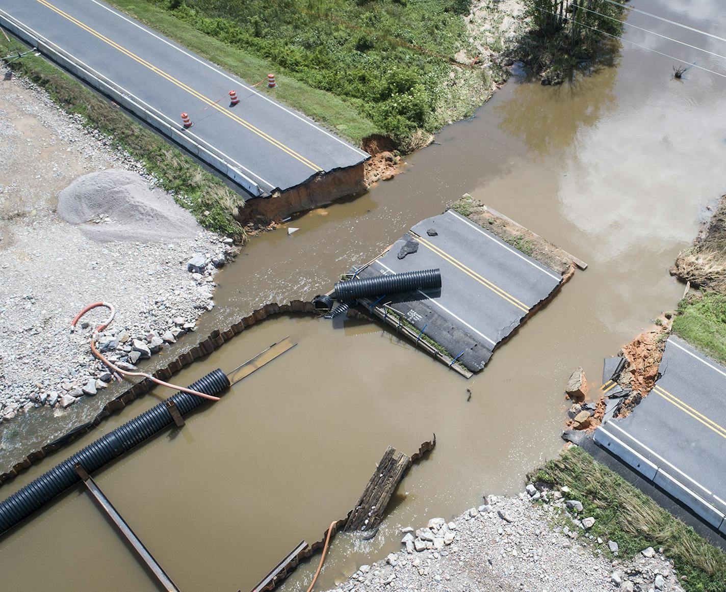 The Midwest isn't the only place feeling the brunt of too much water. Weekend storms caused the Little River to flood and wash out part of Hwy. 401 north of Raleigh, N.C., on Saturday.