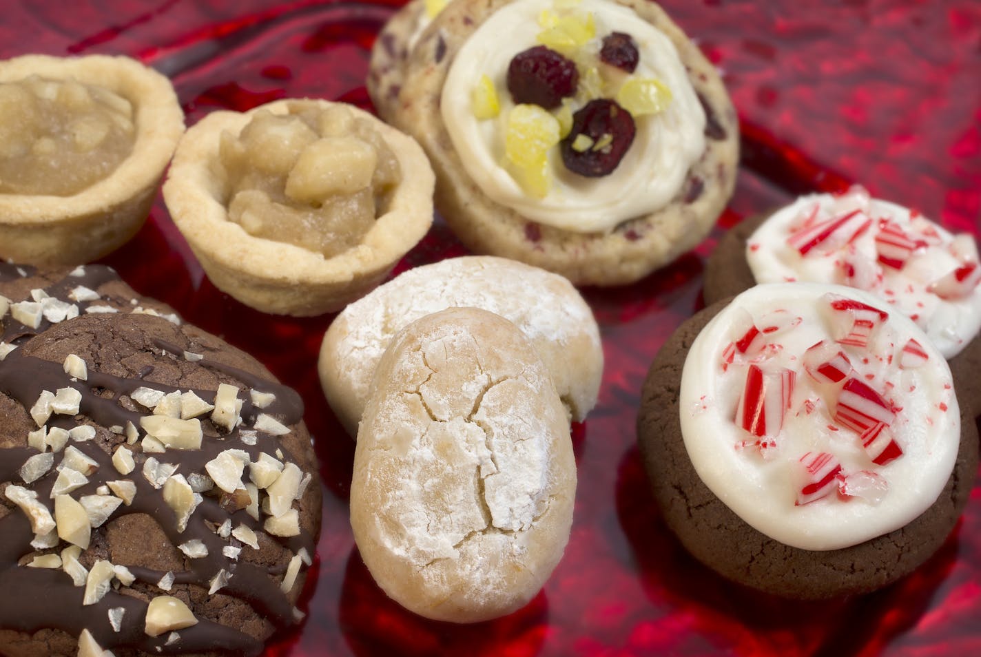 Caption for cookies: The 2014 Taste holiday cookie contest winners include: Italian Almond Cookies, Tart & Sassy Cranberry Lemon Drops; Chocolate Thumbprints; Macadamia Nut Tarts and Espresso-Hazelnut Truffle Cookies. The annual Star Tribune cooky contest