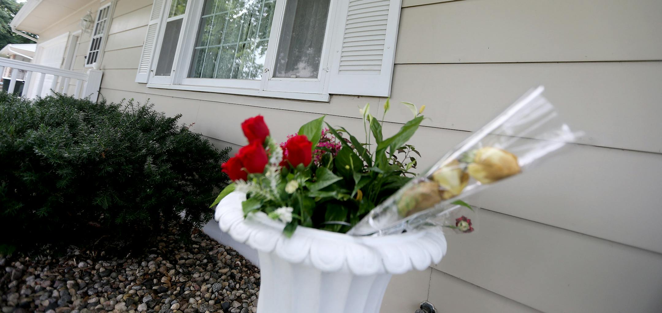 Flowers sat outside the home of Lila Warwick, 79, Thursday, August 15, 2013 in Willmar, MN. Warwick' s grandson Robert Warwick is being charged in her death. (ELIZABETH FLORES/STAR TRIBUNE) ELIZABETH FLORES &#x2022; eflores@startribune.com