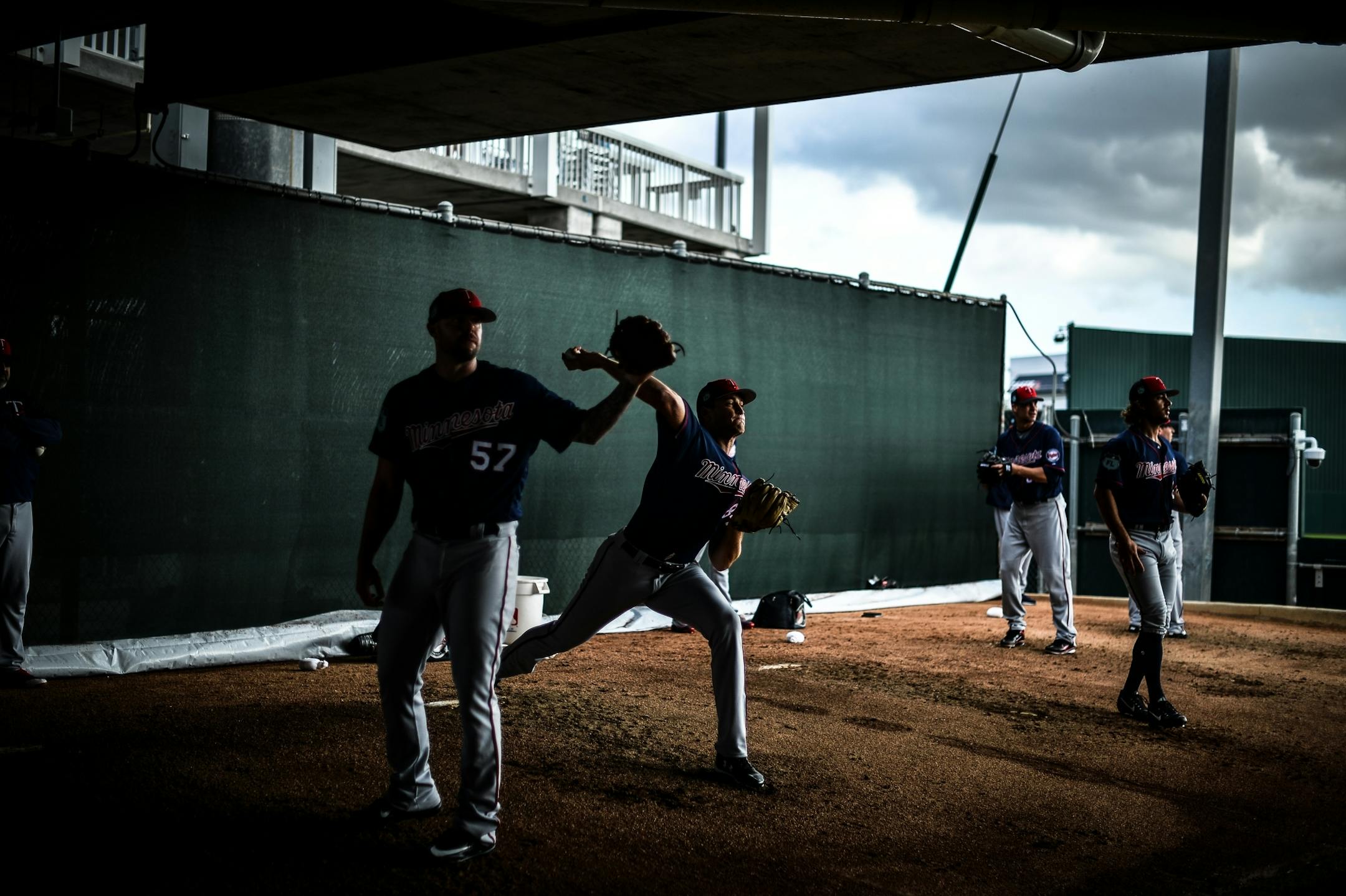 Twins pitchers practiced their throws in the dugout Thursday.