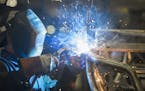 A worker welds the frame for the 2016 Wildcat X side-by-side vehicle at the Arctic Cat factory in Thief River Falls, Minn., on Sept. 30, 2015. (Leila 