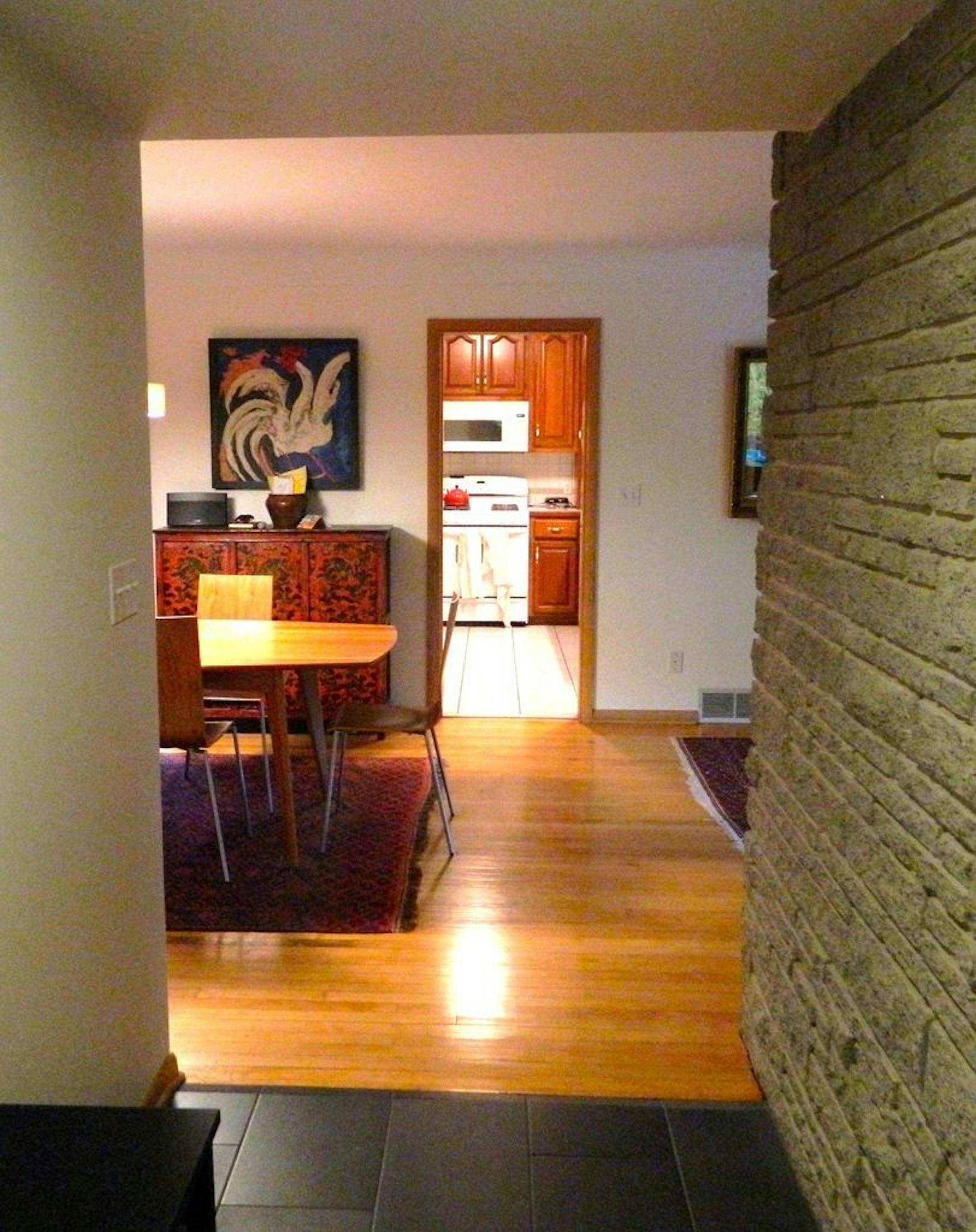 BEFORE The doorway into the closed off kitchen.