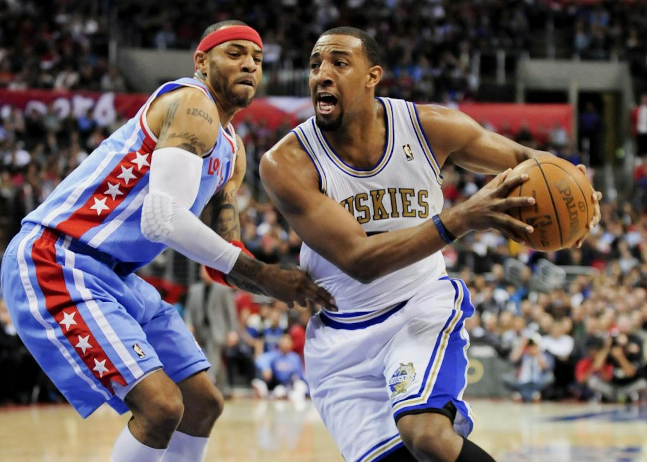 Timberwolves forward Derrick Williams, right, gets by Los Angeles Clippers forward Kenyon Martin, during the opener game of last week's road trip.