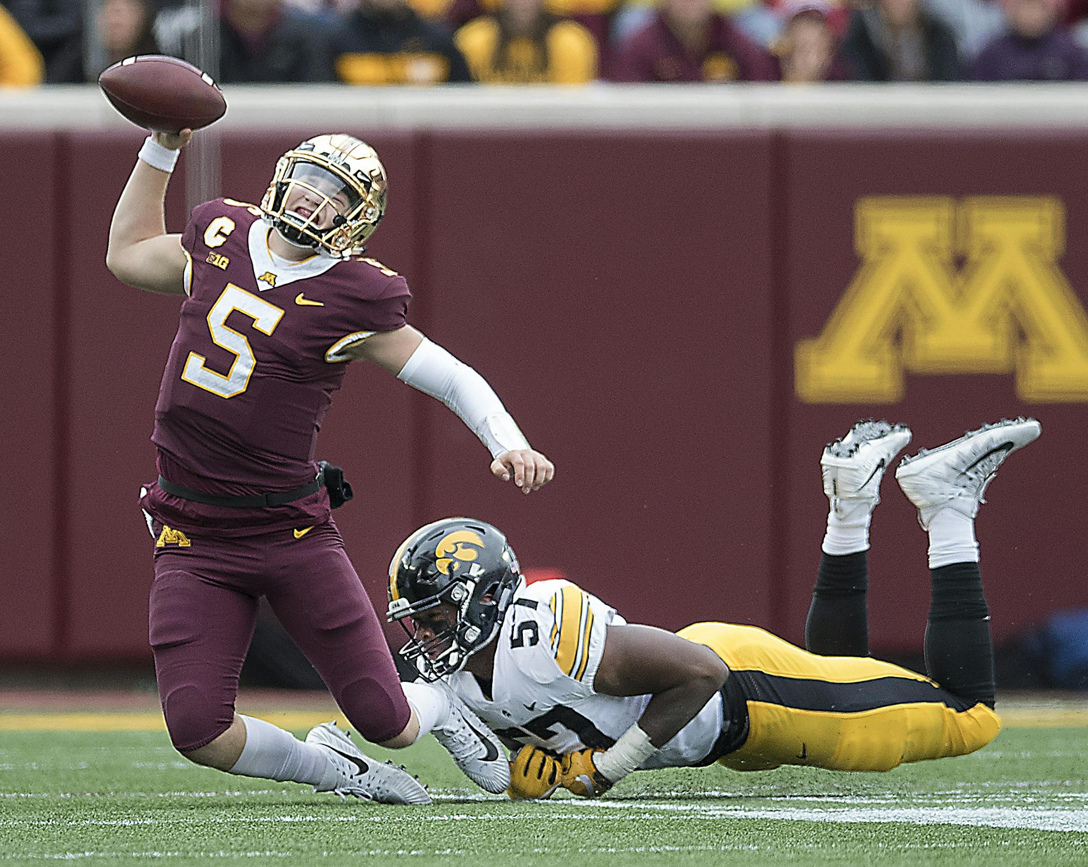 Minnesota's quarterback Zack Annexstad is sacked by Iowa's defensive end Chauncey Golston during the second quarter as Minnesota took on Iowa at TCF Stadium, Saturday, October 6, 2018 in Minneapolis, MN. ] ELIZABETH FLORES ï liz.flores@startribune.com