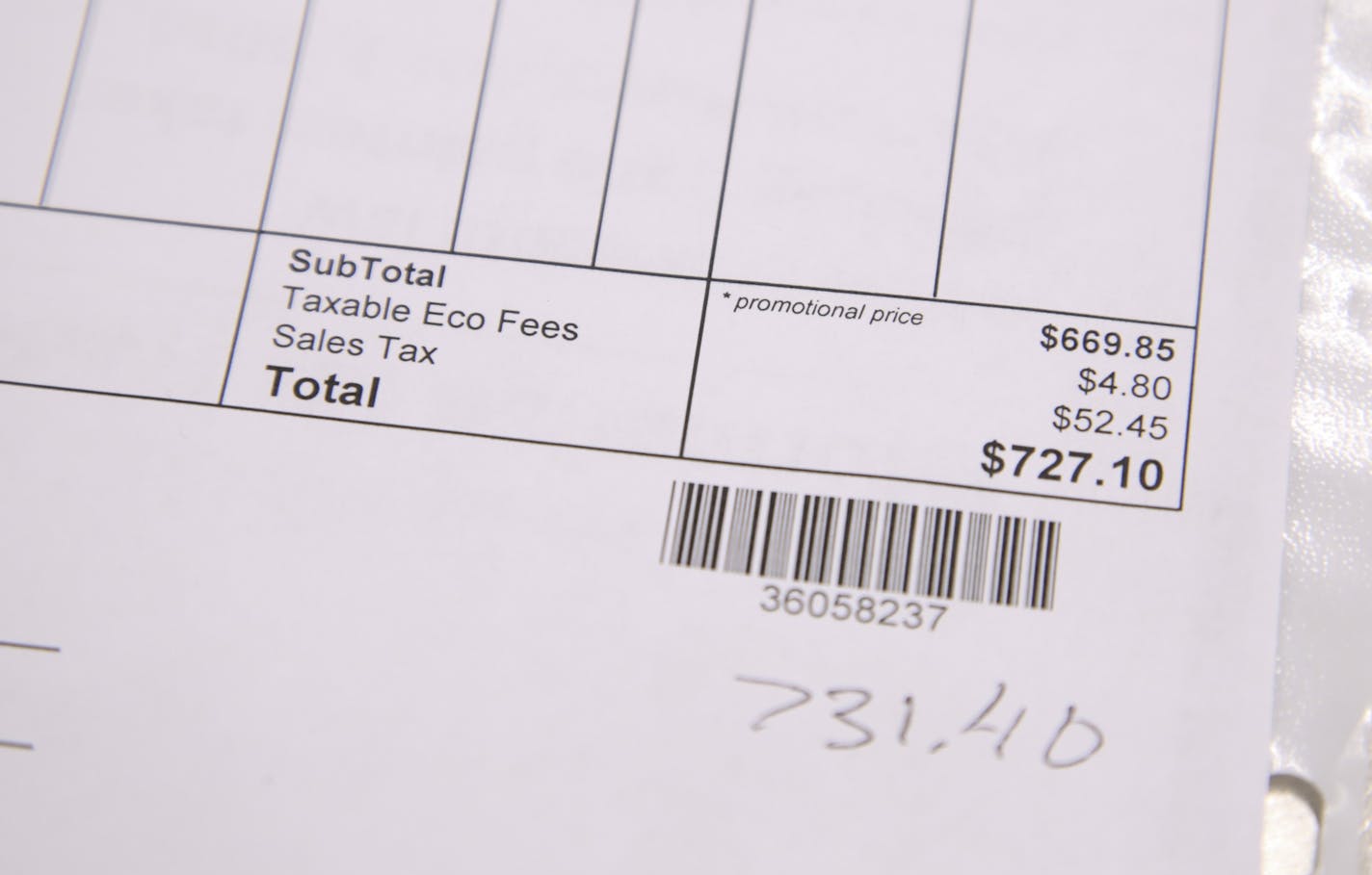 Detail of an invoice at Hirschfield's showing the new fees for the recycling program that are now paid for by consumers.