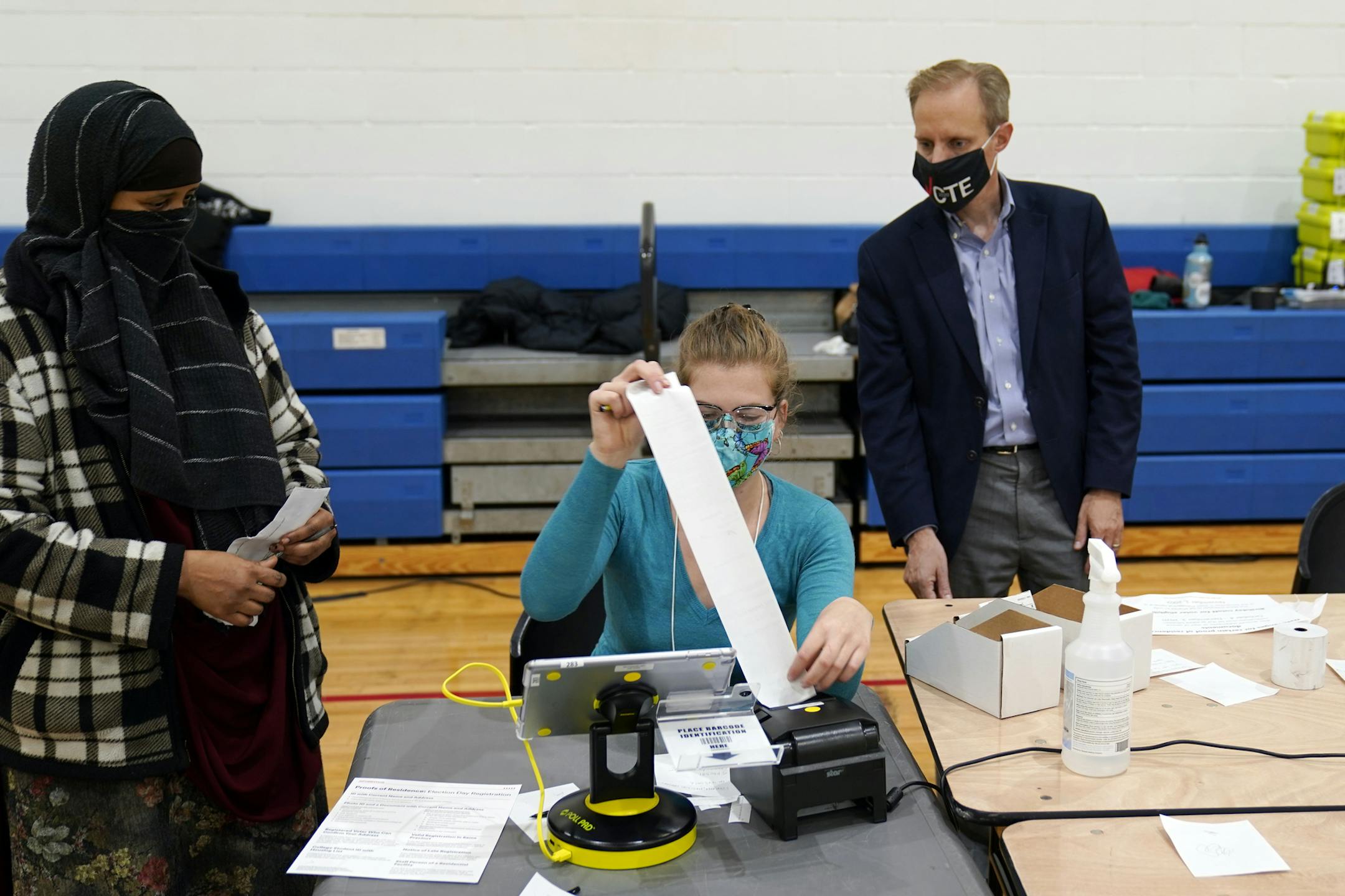 Minnesota Secretary of State Steve Simon visited with poll workers on Election Day Tuesday, Nov. 3, 2020, in Minneapolis. (AP Photo/Jim Mone)