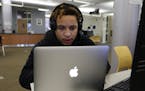 Loronzo Warren, 18, a student at Kennedy-King College in Chicago, works on an assignment on April 8, 2019. He also works part-time at a clothing store