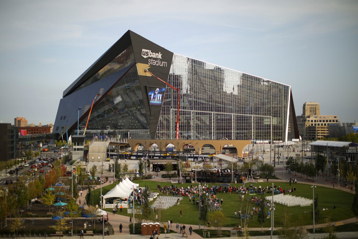 Construction workers attended to panels on the exterior of U.S. Bank Stadium Tuesday evening. ] JEFF WHEELER � jeff.wheeler@startribune.com The Minnesota Orchestra performed a free concert at The Commons in downtown Minneapolis Tuesday evening, September 19, 2017. The hour-long program included Sibelius' "Finlandia" as well as the theme from "Raiders of the Lost Ark" and other works.