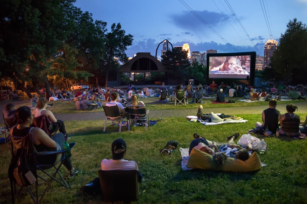 People watch a movie at Father Hennepin Bluff Park beside the Mississippi River in 2017.