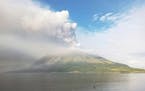 Mount Ruang volcano is seen during the eruption from Tagulandang island, Indonesia, Thursday, April 18, 2024. Indonesian authorities closed an airport