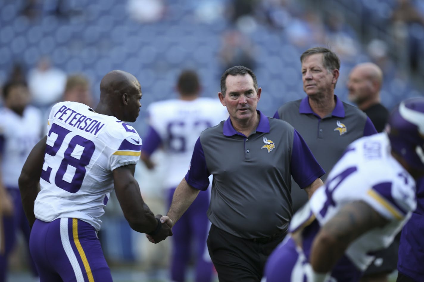 Vikings head coach Mike Zimmer shook hands with all the players, including Adrian Peterson, as they stretched before the game Thursday night.