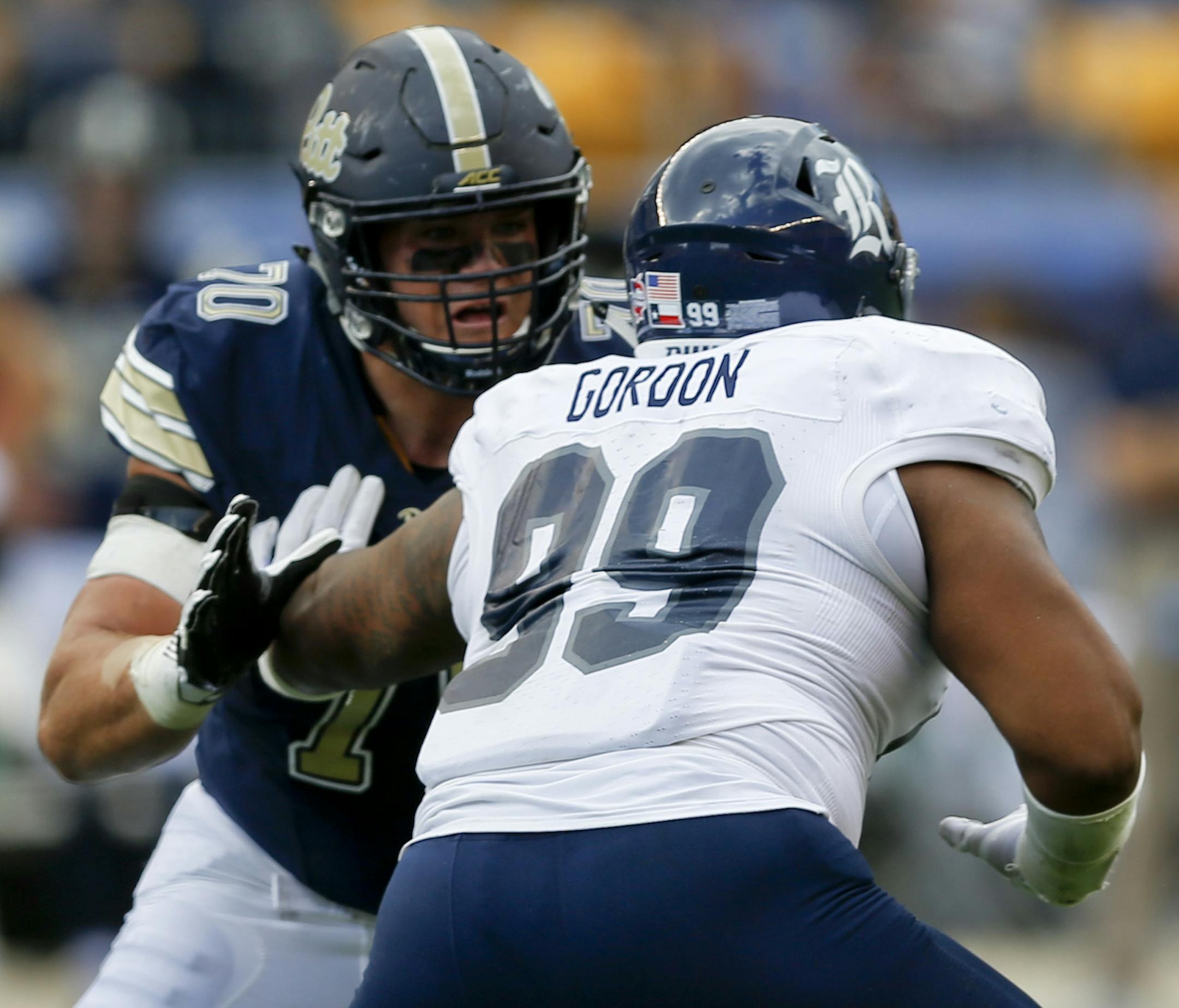 Pittsburgh offensive lineman Brian O'Neill (70), left, blocks Rice defensive tackle Preston Gordon (99) in an NCAA college football game, Saturday, Sept. 30, 2017, in Pittsburgh. (AP Photo/Keith Srakocic) ORG XMIT: PAKS111
