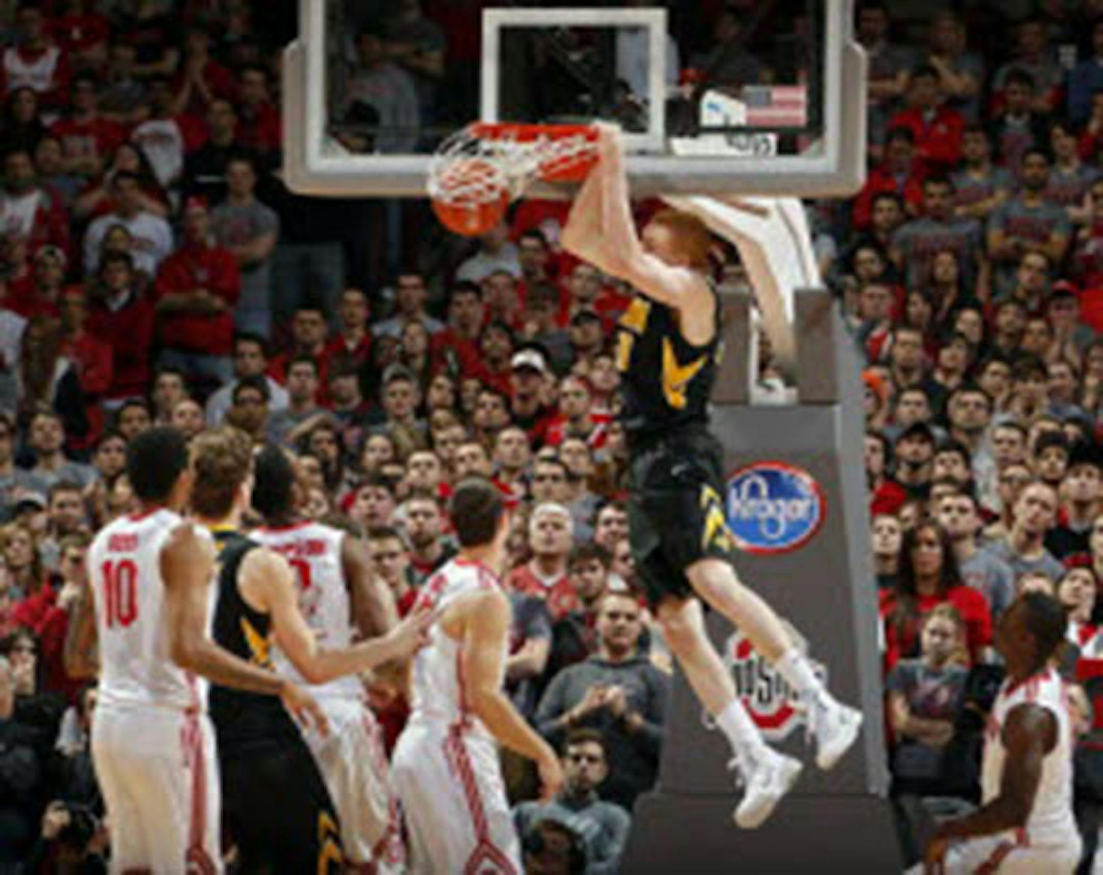 Iowa forward Aaron White threw down a dunk against Ohio State during the second half of the Hawkeyes' 84-74 victory Sunday.