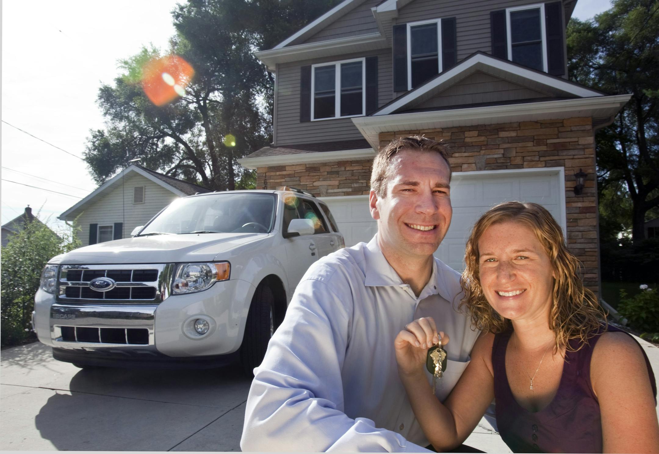 Scott and Adrianne Watkins of Haslitt, Mich., did extensive research on models and deals offered at dealerships before settling on buying a 2011 Ford Escape. They bought for less than Ford's "friends and family" company discount.