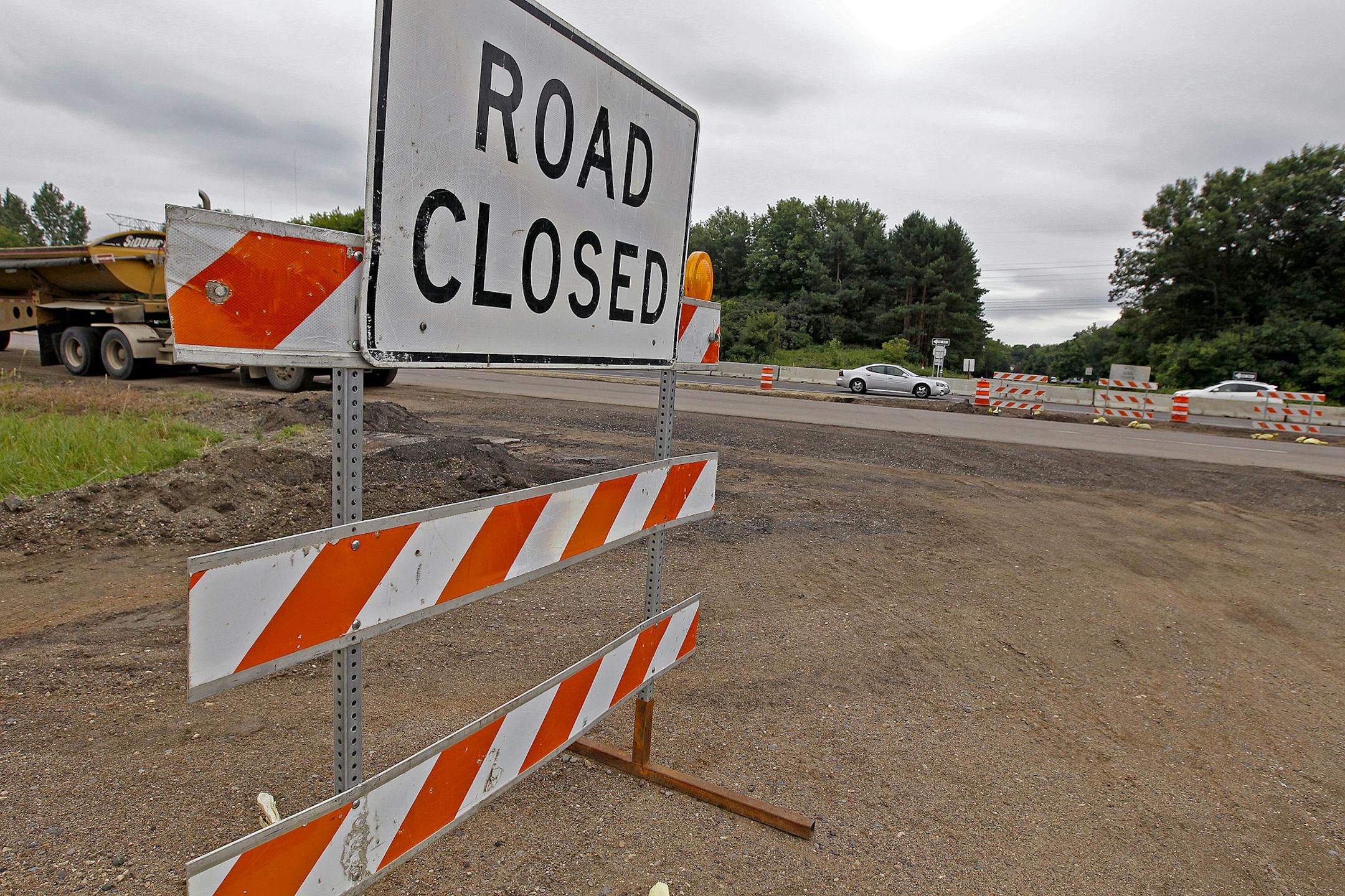 Traffic made its way through ongoing road construction along Highway 36, Tuesday, July 30, w013 in Oakdale, MN. Potential designs for Hwy. 36 interchanges in Oakdale would eliminate stoplights, creating a faster commuter corridor through that city. That work would come after work is completed at Hilton Trail interchange in Pine Springs and farther to the west, at the rebuilding of English Street interchange in Maplewood. In both cases stoplights were eliminated. Once Hwy. 36 is refashioned throu