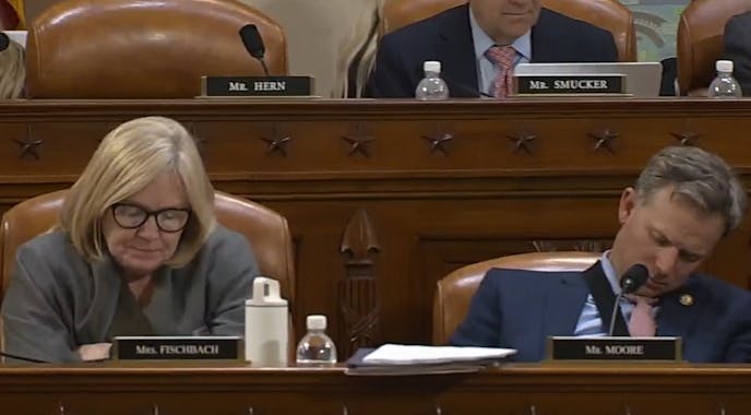 Rep. Michelle Fischbach nudged her colleague Rep. Blake Moore awake to cast a vote on Wednesday.