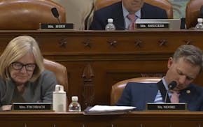 Rep. Michelle Fischbach nudged her colleague Rep. Blake Moore awake to cast a vote on Wednesday.