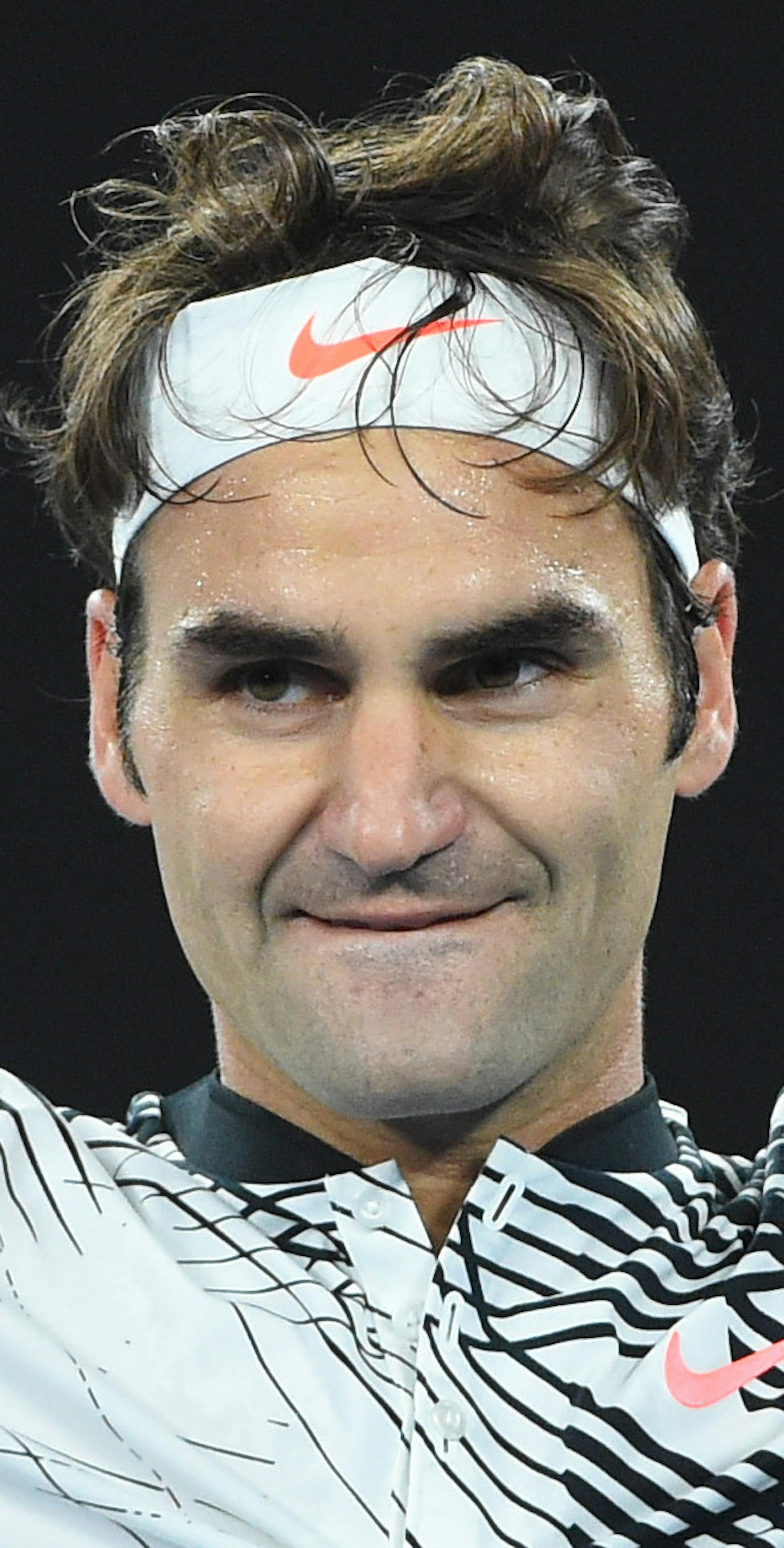 Roger Federer of Switzerland celebrates amid a five-set victory against fellow countryman Stan Wawrinka in the semifinals of the Australian Open at Melbourne Park in Melbourne, Australia, on Thursday, Jan. 26, 2017. (Corinne Dubreuil/Abaca Press/TNS)