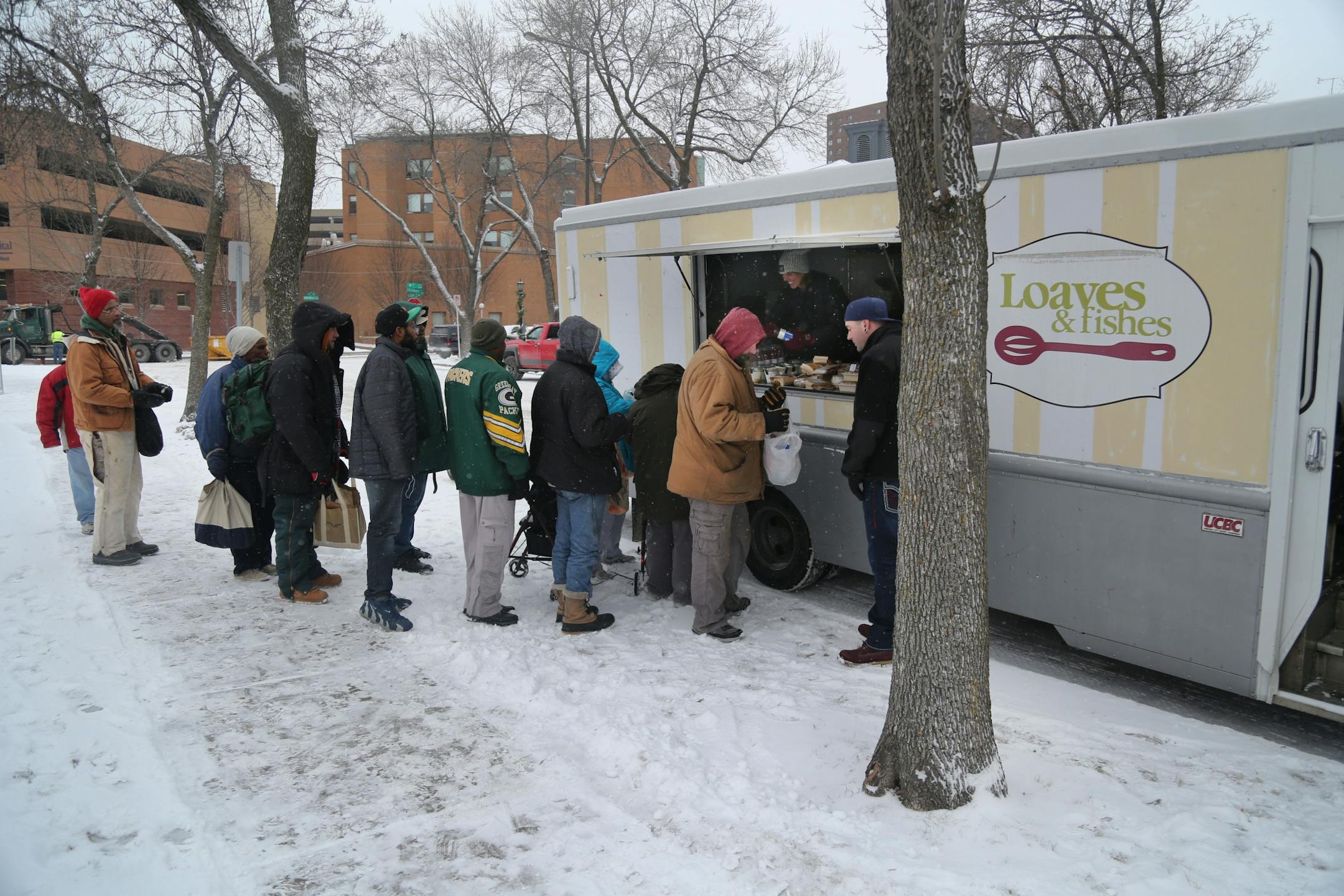 The local non-profit, Loaves and Fishes has partnered with the MSP Airport and concessionaire HMS Host to donate ready-to-eat meals not purchased at the airport, that would otherwise be thrown away, to the homeless near the Dorothy Day Center Thursday, Dec. 28, in St. Paul, MN.