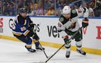 Minnesota Wild's Frederick Gaudreau (89) works the puck against St. Louis Blues' Jordan Kyrou (25) during the first period in Game 4 of an NHL hockey 
